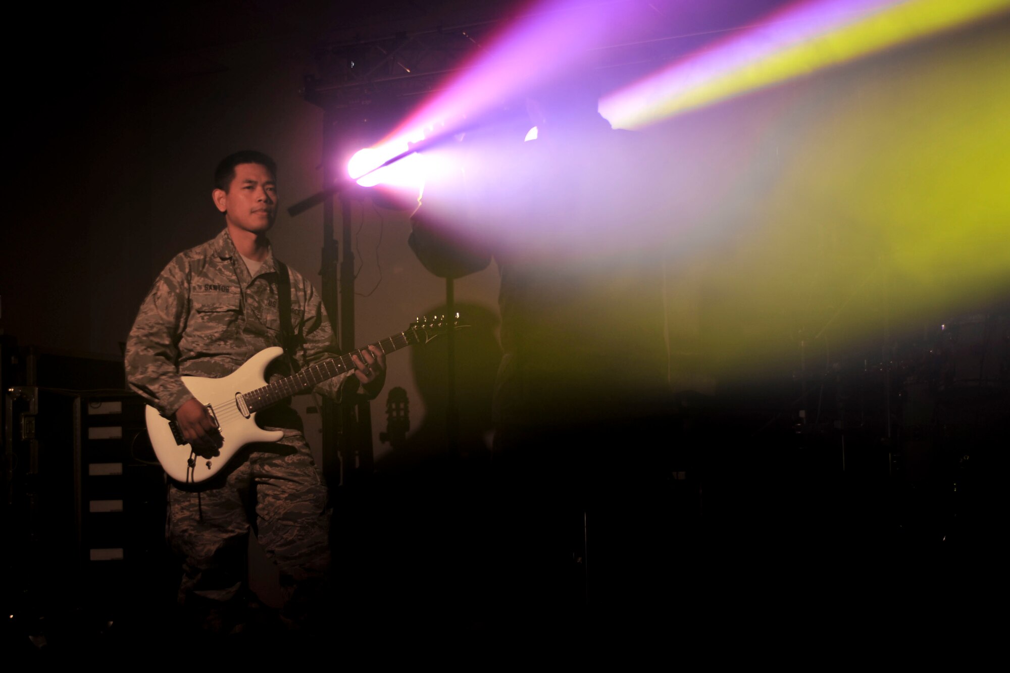 U.S. Air Force Staff Sgt. Daniel Santos, Full Spectrum guitarist, plays during a rehearsal at Langley Air Force Base, Va., Jan. 20, 2016. The band was originally created in 2013 to support U.S. and coalition forces that were deployed to Southwest Asia. (U.S. Air Force photo by Tech. Sgt. Katie Gar Ward)