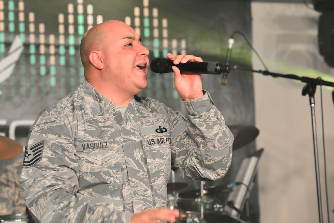 U.S. Air Force Tech. Sgt. Richard Vasquez, Full Spectrum noncommissioned officer in charge of auditions and vocals, sings during a rehearsal at Langley Air Force Base, Va., Jan. 20, 2016. The band recently deployed for 110 days to parts of the Middle East and Southwest Asia, performing in the regions’ schools and malls, as well as on radio and television shows. (U.S. Air Force photo by Tech. Sgt. Katie Gar Ward)