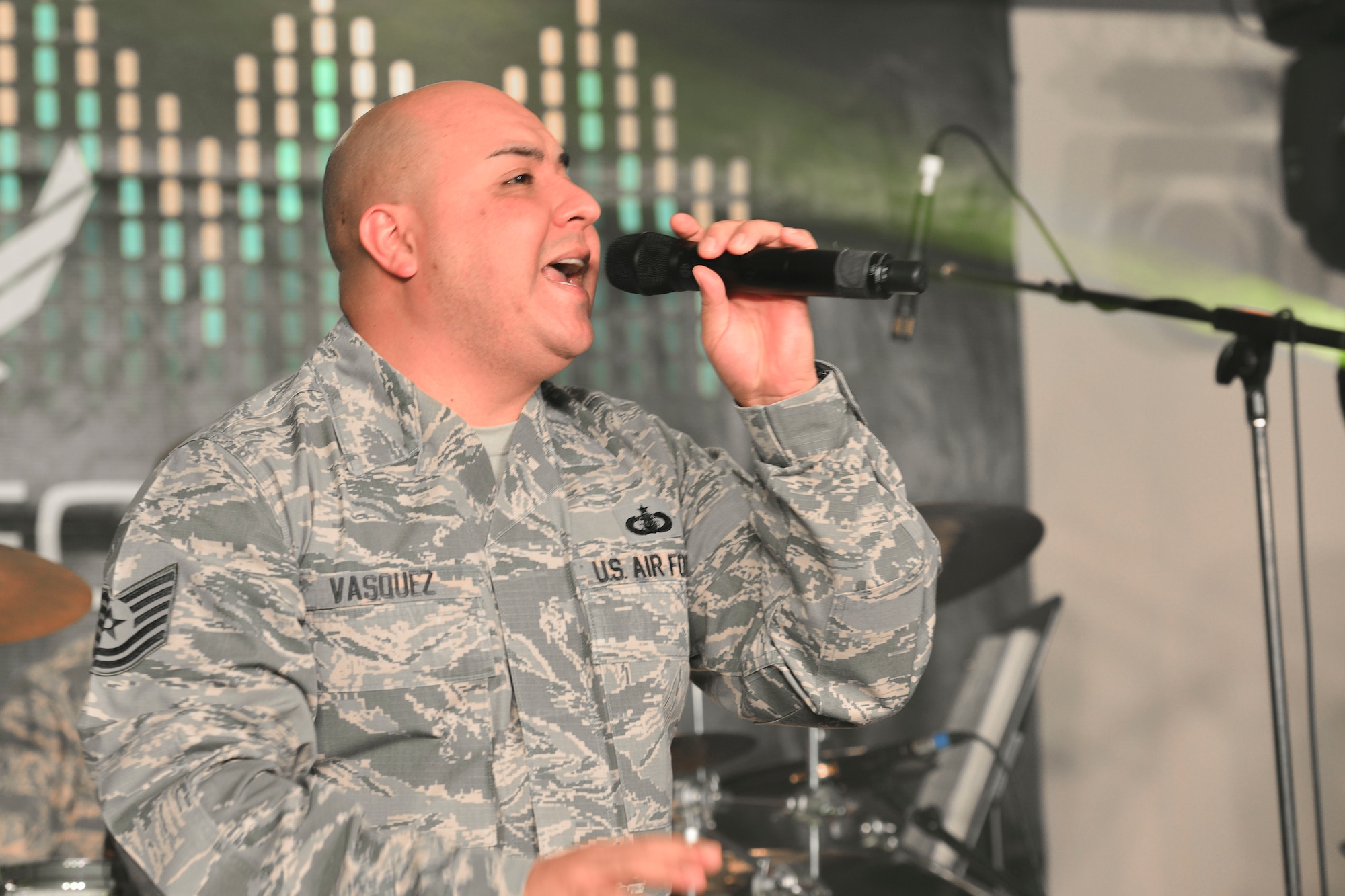 U.S. Air Force Tech. Sgt. Richard Vasquez, Full Spectrum noncommissioned officer in charge of auditions and vocals, sings during a rehearsal at Langley Air Force Base, Va., Jan. 20, 2016. The band recently deployed for 110 days to parts of the Middle East and Southwest Asia, performing in the regions’ schools and malls, as well as on radio and television shows. (U.S. Air Force photo by Tech. Sgt. Katie Gar Ward)