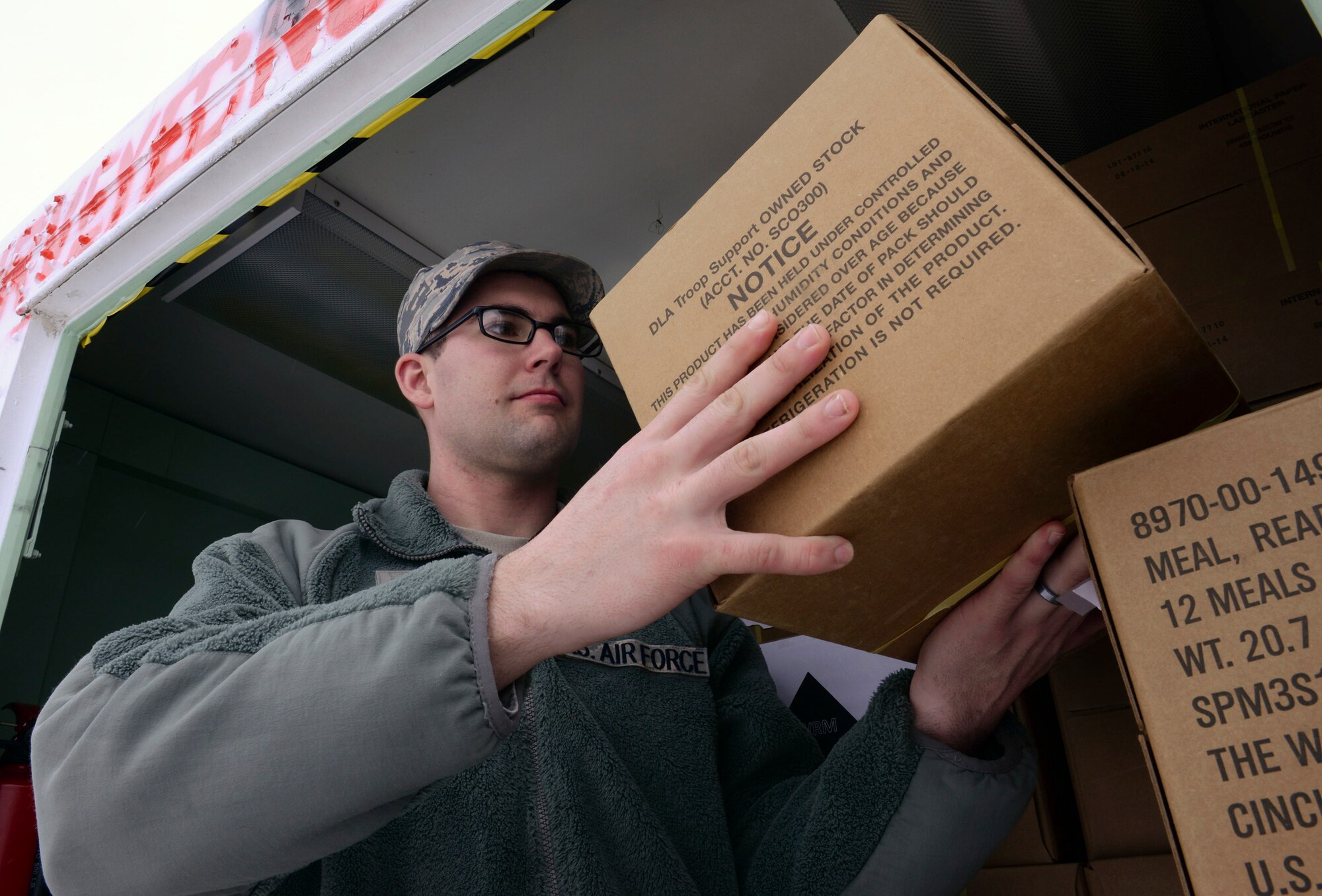 U.S. Air Force Staff Sgt. Daniel Jones, A 509th Force Support Squadron in-flight kitchen manager, checks the accountability of War Reserve Material MREs at Whiteman Air Force Base, Mo., Jan. 20, 2016. Jones said his favorite part of his job is being hands-on while supporting the Whiteman Mission. (U.S. Air Force photo by Senior Airman Marrero)