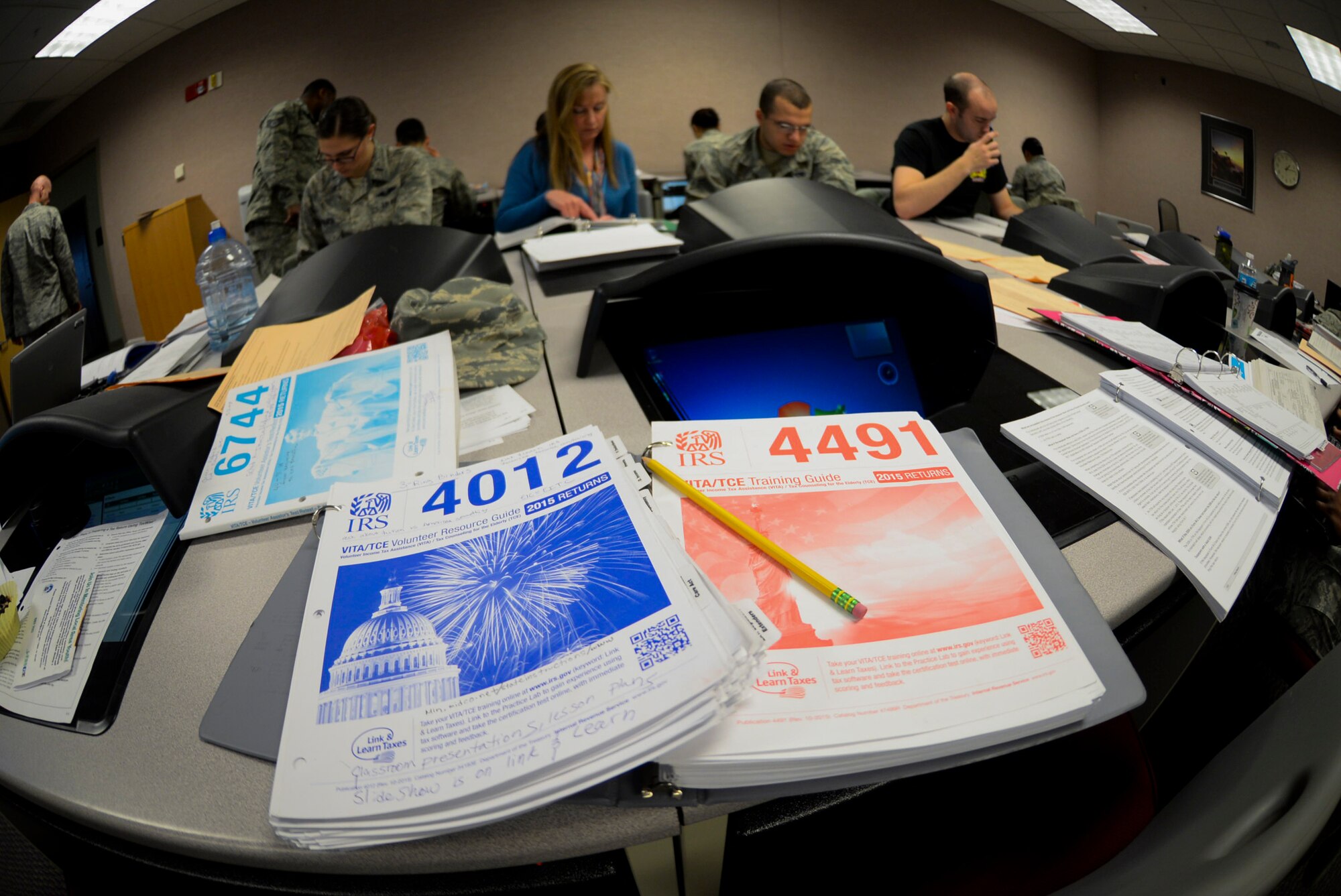 The 509th Bomb Wing legal office offered IRS tax training center volunteers at Whiteman Air Force Base, Mo. Jan. 19, 2016. Trainers used variety of guides to teach volunteers how to properly file tax returns. (U.S. Air Force photo by Senior Airman Sandra Marrero)