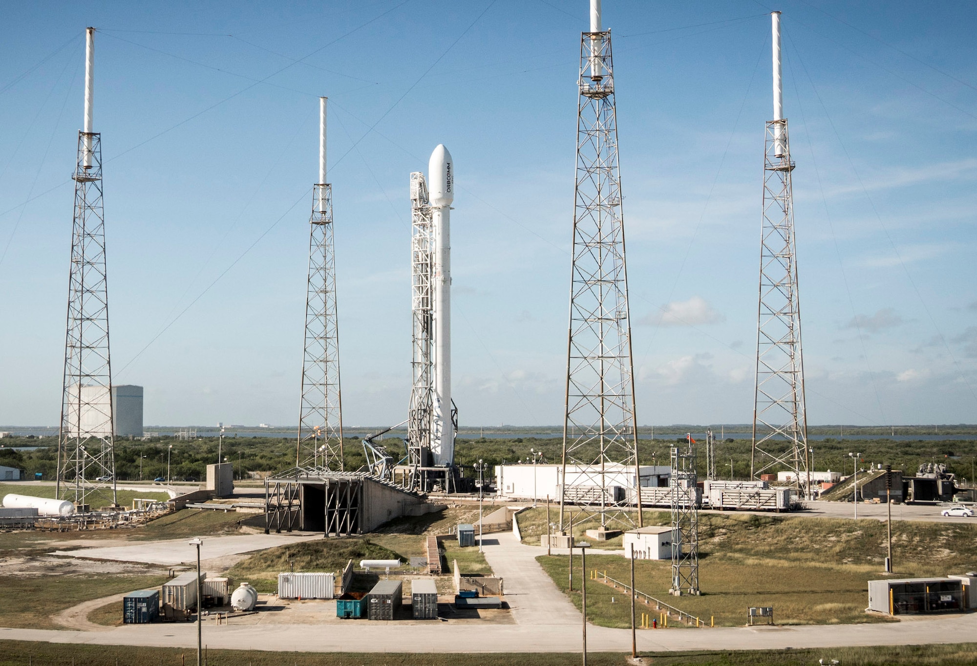 A Falcon 9 upgrade sits poised on Space Launch Complex 40 at Cape Canaveral Air Force Station prior to its launch on Dec. 21, 2015. This was the first commercial launch of the Falcon 9 upgrade, which the Air Force certified for National Security Space launches on Jan. 25.  The upgraded version is taller and has more thrust than the previous version of the rocket. Standing 229 feet tall, the Falcon 9 upgrade burns a super-chilled mixture of liquid oxygen and rocket-grade kerosene colder than the propellants consumed on SpaceX’s earlier launches.  SpaceX successfully landed the rocket’s first stage booster in a landing zone approximately six miles south of the launch pad. (Photo/SpaceX)