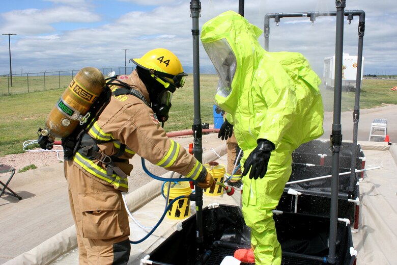 Fire and Emergency Services personnel perform hazardous material training July 29, 2015, at Schriever Air Force Base, Colorado. For fourth time in the last five years, the Schriever Fire Department earned the Air Force Space Command Small Fire Department of the Year award Wednesday, Jan. 20, 2016. (U.S. Air Force photo/Mark Captain)