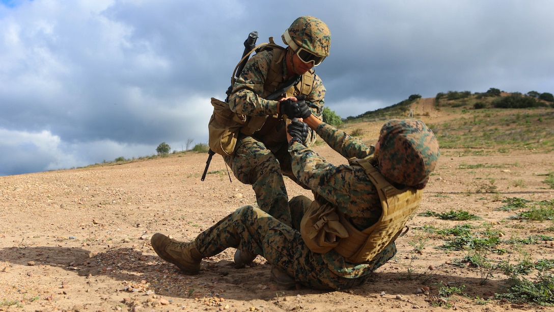 Marines with Marine Wing Headquarters Squadron (MWHS) 3 perform a simulated casualty evacuation during their Command Post Exercise aboard Marine Corps Air Station Miramar, California, Jan. 19. Marines with MWHS-3 participated in a three-day, two-night CPX designed to instill and improve field and tactical skills of the Headquarter Marines, Jan. 19-21.