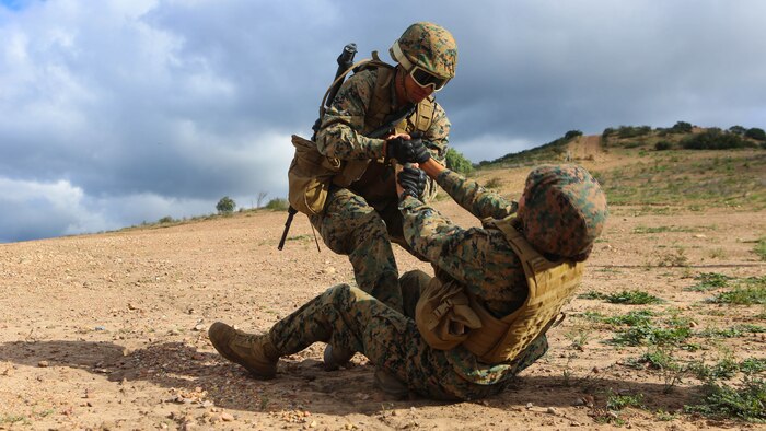 Marines with Marine Wing Headquarters Squadron (MWHS) 3 perform a simulated casualty evacuation during their Command Post Exercise aboard Marine Corps Air Station Miramar, California, Jan. 19. Marines with MWHS-3 participated in a three-day, two-night CPX designed to instill and improve field and tactical skills of the Headquarter Marines, Jan. 19-21.