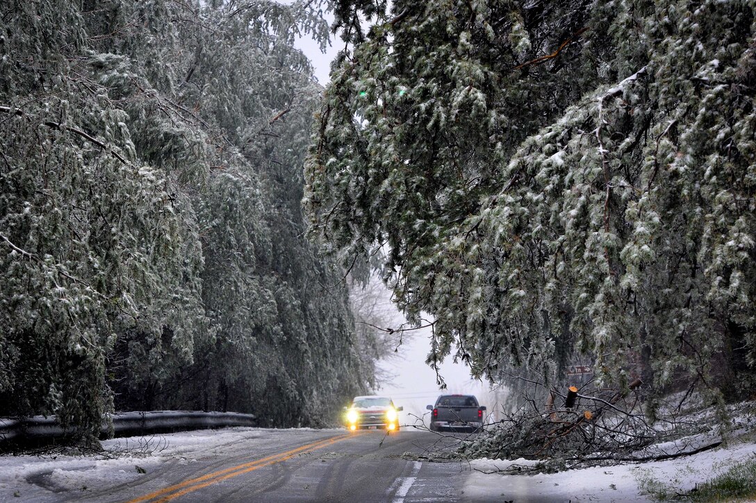 Vehicles travel cautiously along a road between Greenville and Travelers Rest, S.C., during a winter storm, Jan. 22, 2016. The storm caused considerable damage to numerous power lines in the area. South Carolina National Guard photo by Army Staff Sgt. Roby Di Giovine