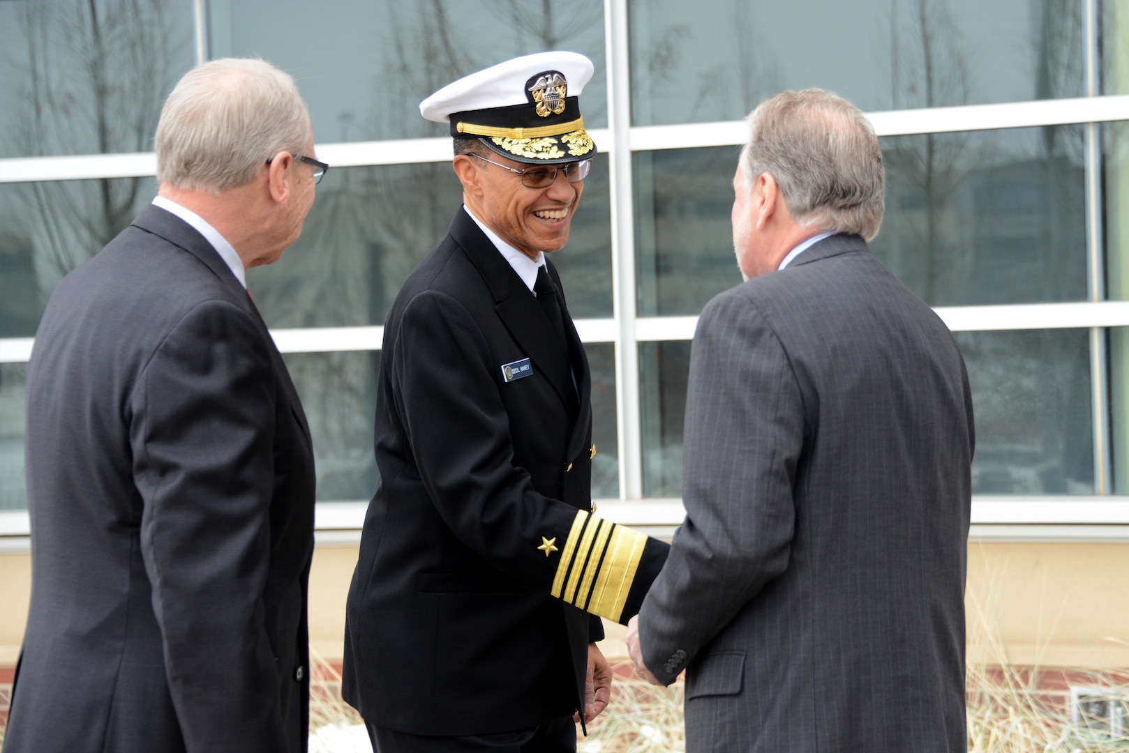 U.S. Navy Adm. Cecil D. Haney (center), U.S. Strategic Command (USSTRATCOM) commander, speaks to Dr. John Christensen (left), University of Nebraska at Omaha (UNO) chancellor, and Dr. Louis Pol, Dean of UNO's College of Business Administration, during his arrival at the USSTRATCOM Leader Fellowship Program kick-off event at UNO's Mammel Hall, Omaha, Neb., Jan. 23, 2016. During the event, Haney and other senior leaders from the command joined University of Nebraska senior leaders and faculty in recognizing the 10 USSTRATCOM Fellows for their selection into the program. The 13-week course brings civilian employees together with national security and defense experts from the University of Nebraska for a classroom-based, hands-on learning opportunity that will provide graduate-level leadership development. UNO, the University of Nebraska and USSTRATCOM launched the initiative in March 2014 under the University of Nebraska's National Strategic Research Institute (NSRI), one of only 13 Department of Defense-sponsored University Affiliated Research Centers (UARCs) in the nation. One of nine DoD unified combatant commands, USSTRATCOM has global strategic missions, assigned through the Unified Command Plan, which include strategic deterrence; space operations; cyberspace operations; joint electronic warfare; global strike; missile defense; intelligence, surveillance and reconnaissance; combating weapons of mass destruction; and analysis and targeting. (USSTRATCOM photo by U.S. Air Force Staff Sgt. Jonathan Lovelady)