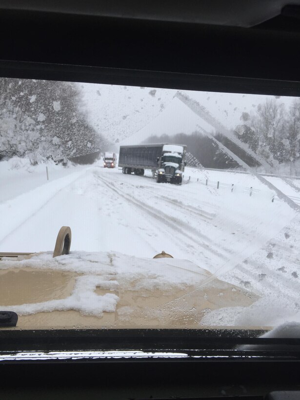 Soldiers supporting winter storm response operations travel in a Humvee toward a stranded semitruck driver on Interstate 75 south of Lexington, Ky., Jan. 23, 2016. Kentucky National Guard photo