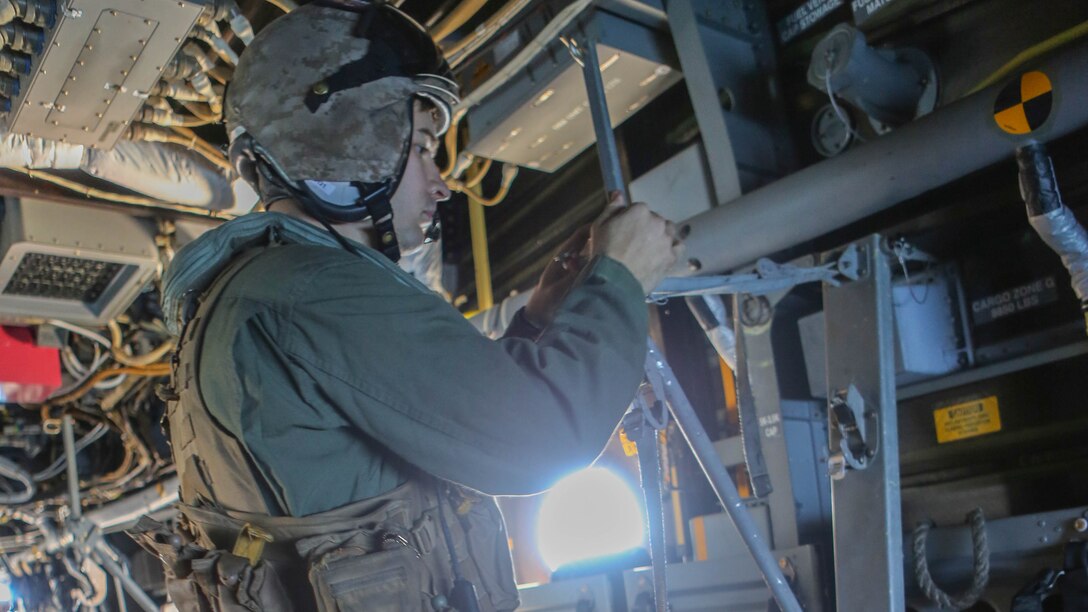Cpl. Joshua Payne, a crew chief with Marine Medium Tiltrotor Squadron  161 and a Spring, Texas, native, prepares the litter stanchion, a support mechanism for a stretcher, during casualty-evacuation training aboard Marine Corps Base Camp Pendleton, Calif., Jan. 20, 2016. Casualty-evacuation training prepares the Marines to land in a combat zone, pick up injured Marines and transport them to a safe area. 