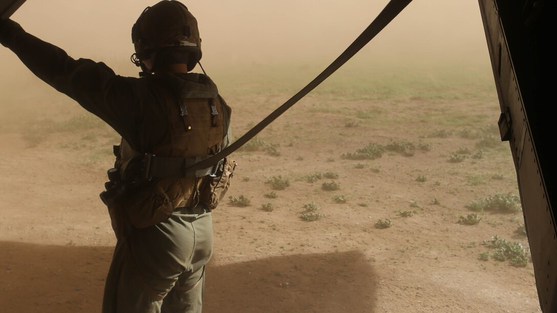 Cpl. Joshua Payne, a crew chief with Marine Medium Tiltrotor Squadron 161 and a Spring, Texas, native, waits for a simulated injured Marine during casualty-evacuation training aboard Marine Corps Base Camp Pendleton, Calif., Jan. 20, 2016. Casualty-evacuation training prepares the Marines to land in a combat zone, pick up injured Marines and transport them to a safe area. 
