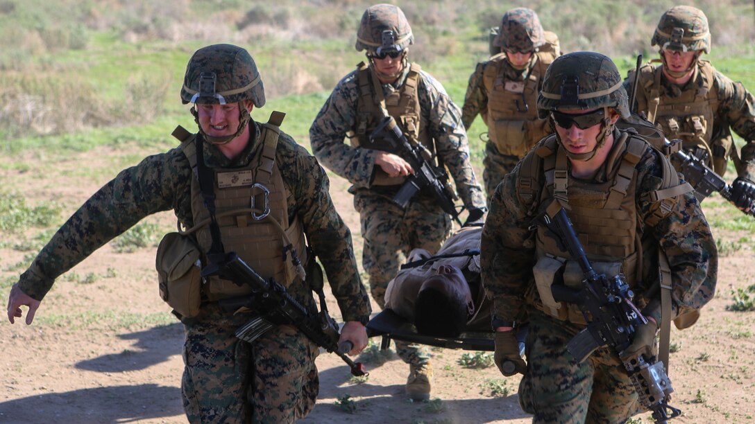 Marines preparing to deploy with the 31st Marine Expeditionary Unit carry an injured Marine on a litter to an MV-22B Osprey with Marine Medium Tiltrotor Squadron 161 during casualty-evacuation training aboard Marine Corps Base Camp Pendleton, Calif., Jan. 20, 2016. Casualty-evacuation training prepares the Marines to land in a combat zone, pick up injured Marines and transport them to a safe area. 