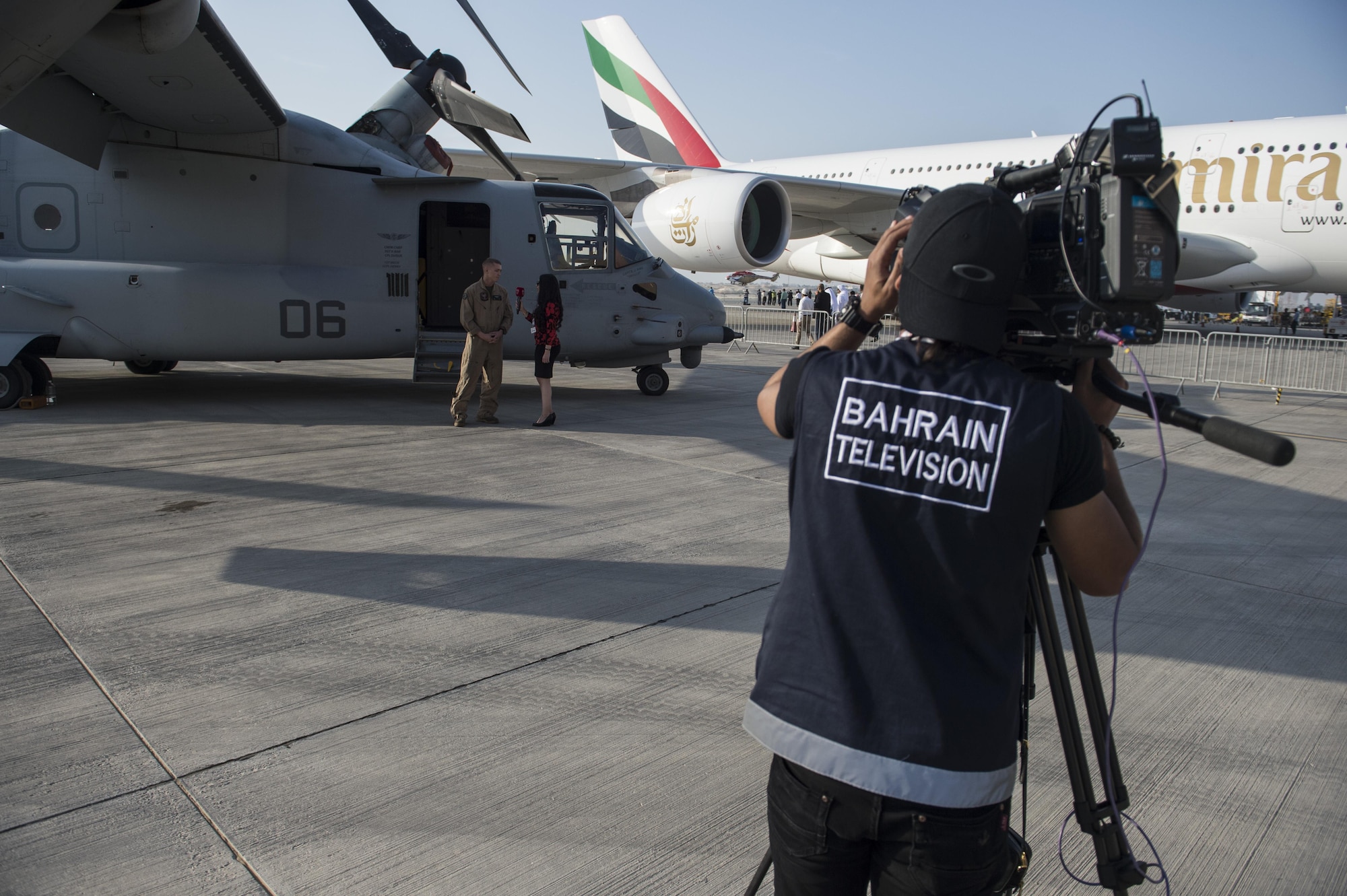 A reporter from Bahrain Television interviews a United States Marine at the Bahrain International Airshow at Sakhir Airbase in Manama, Bahrain, Jan. 21, 2016. The Bahrain International Airshow 2016 is a biennial, three-day aviation and aerospace industry event that provides the U.S. military an opportunity to highlight DOD aviation technology. (U.S. Air Force photo by Staff Sgt. Corey Hook/Released)