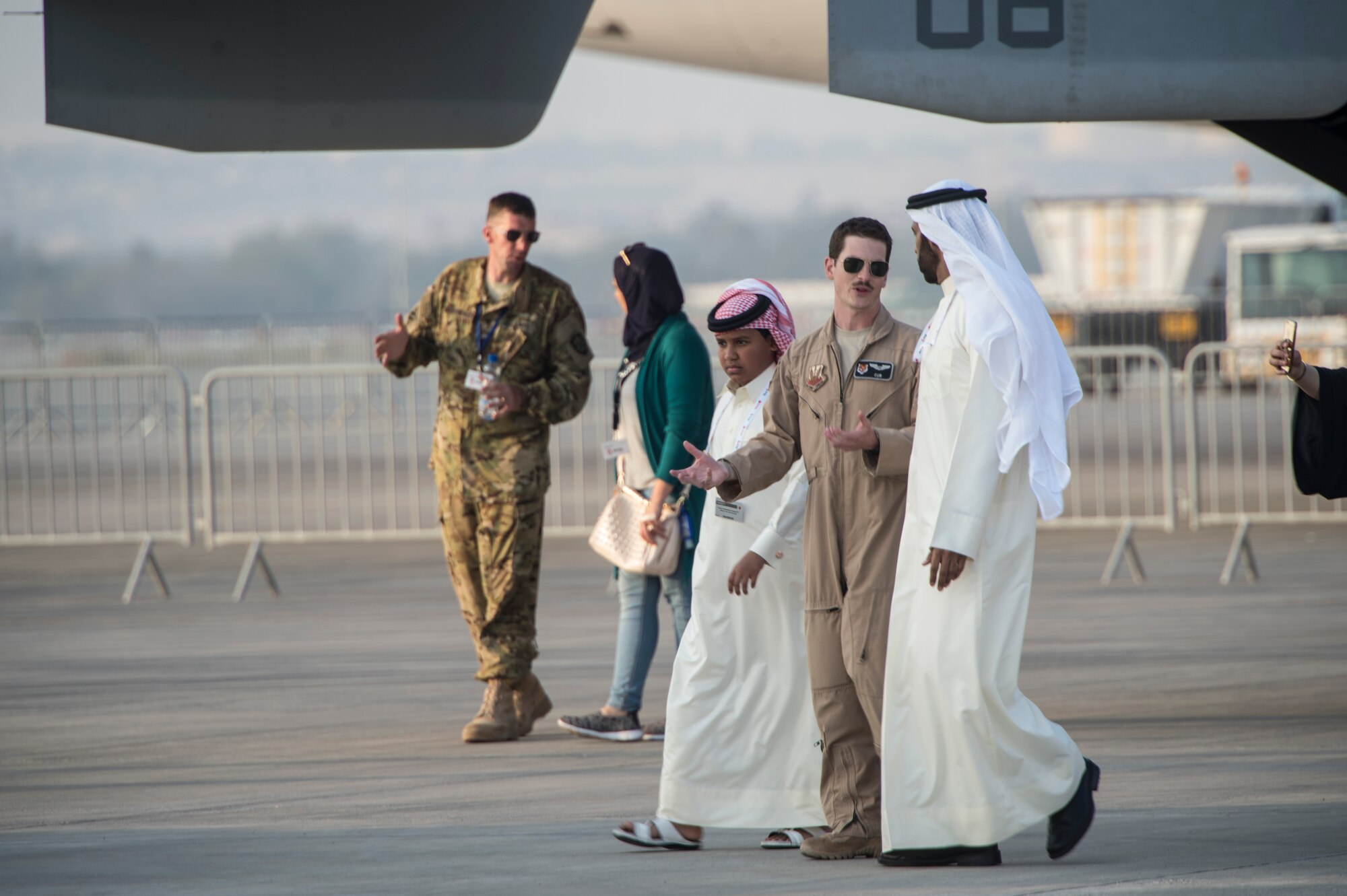 Members from the United States military give Bahrain airshow guests a tour of U.S.military aircraft during the Bahrain International Airshow at Sakhir Airbase in Manama, Bahrain, Jan. 21, 2016. The Bahrain International Airshow 2016 featured a variety of U.S. military aircraft through static displays, including: F-15E Strike Eagle, C2 Greyhound, F-18 E/F Hornet, MV-22 Osprey, AV-8B Harrier, F/18 C/D Hornet , and MH-60 Seahawk and MH-53 Sea Dragon helicopters. (U.S. Air Force photo by Staff Sgt. Corey Hook/Released)