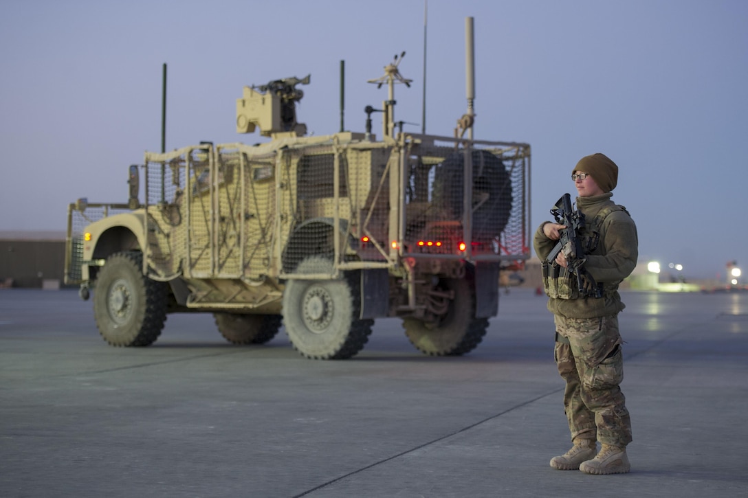 Air Force Senior Airman Allysa Thompson checks a security forces post on the flightline on Kandahar Airfield, Afghanistan, Jan. 21, 2016. Thompson is a section supervisor assigned to the 451st Expeditionary Support Squadron Security Forces Flight. U.S. Air Force photo by Tech. Sgt. Robert f