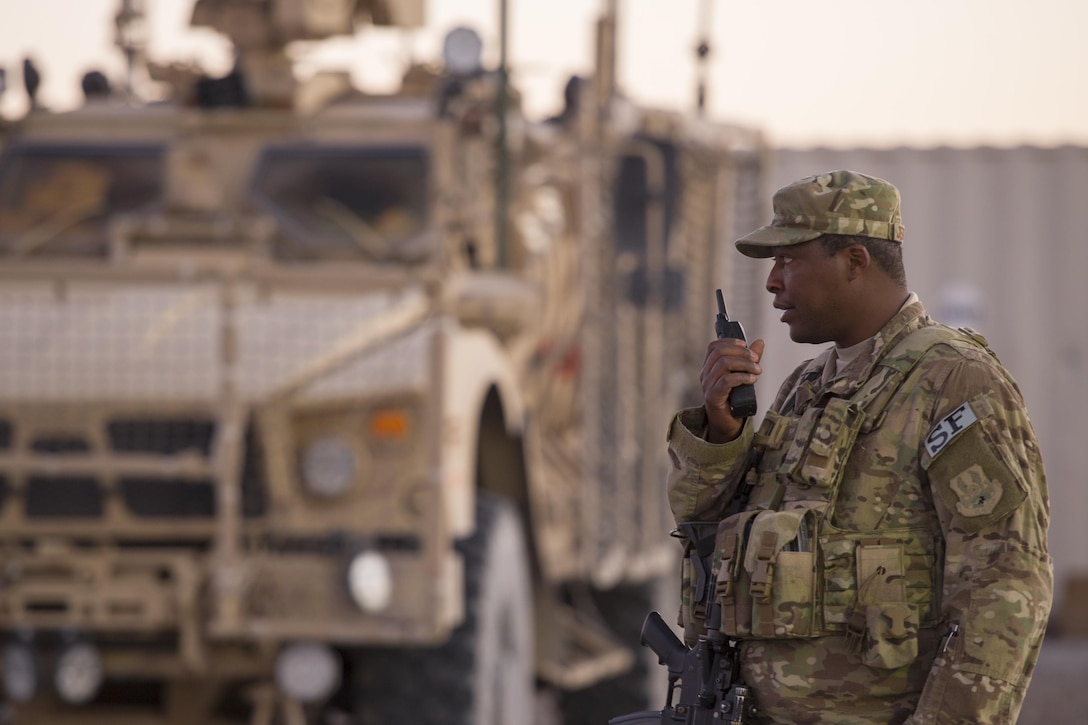 Air Force Tech. Sgt. James Jefferson radios in the status of a vehicle on Kandahar Airfield, Afghanistan, Jan. 21, 2016. Jefferson is a flightline security mid-shift flight chief assigned to the 451st Expeditionary Support Squadron Security Forces Flight. U.S. Air Force photo by Tech. Sgt. Robert Cloys