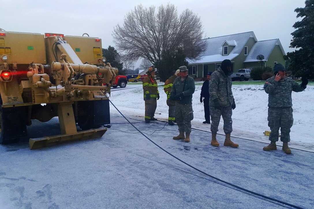 Soldiers support the South Carolina Highway Patrol during winter snow storm response operations in Spartanburg, South Carolina, Jan 23, 2016. The soldiers are assigned to the South Carolina Army National Guard. More than 80 guardsmen were mobilized to assist in keeping roads clear as ice and snow caused dangerous conditions during a large blizzard that struck the eastern United States. South Carolina National Guard photo