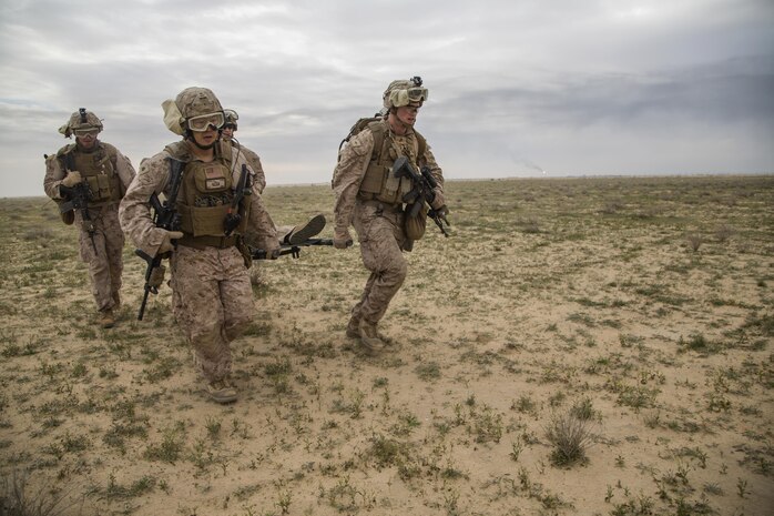 U.S. Marines with Charlie Company, 1st Battalion 7th Marine Regiment, Special Purpose Marine Air-Ground Task Force-Crisis Response-Central Command, recover a simulated casualty as part of a Tactical Recovery of Aircraft and Personnel exercise at an Undisclosed Location in Southwest Asia Jan. 12, 2016. SPMAGTF-CR-CC is ready to respond to any crisis response mission in theater to include the employment of a TRAP force. (U.S. Marine Corps photo by Cpl. Akeel Austin/Released)