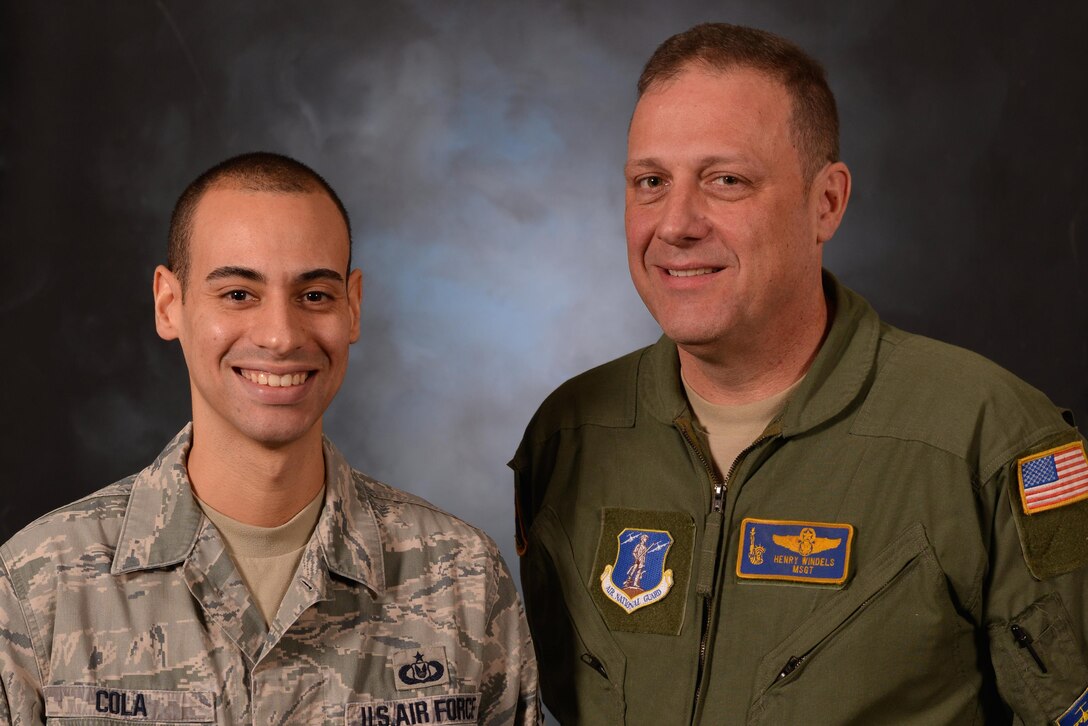 New York Air National Guard Staff Sgt. Daniel Cola, left, and Master Sgt. Henry Windels of the 105th Airlift Wing pose for a photo at Stewart Air National Guard Base, near Newburgh, N.Y., Dec. 23, 2015. New York Air National Guard photo by Staff Sgt. Julio Olivencia