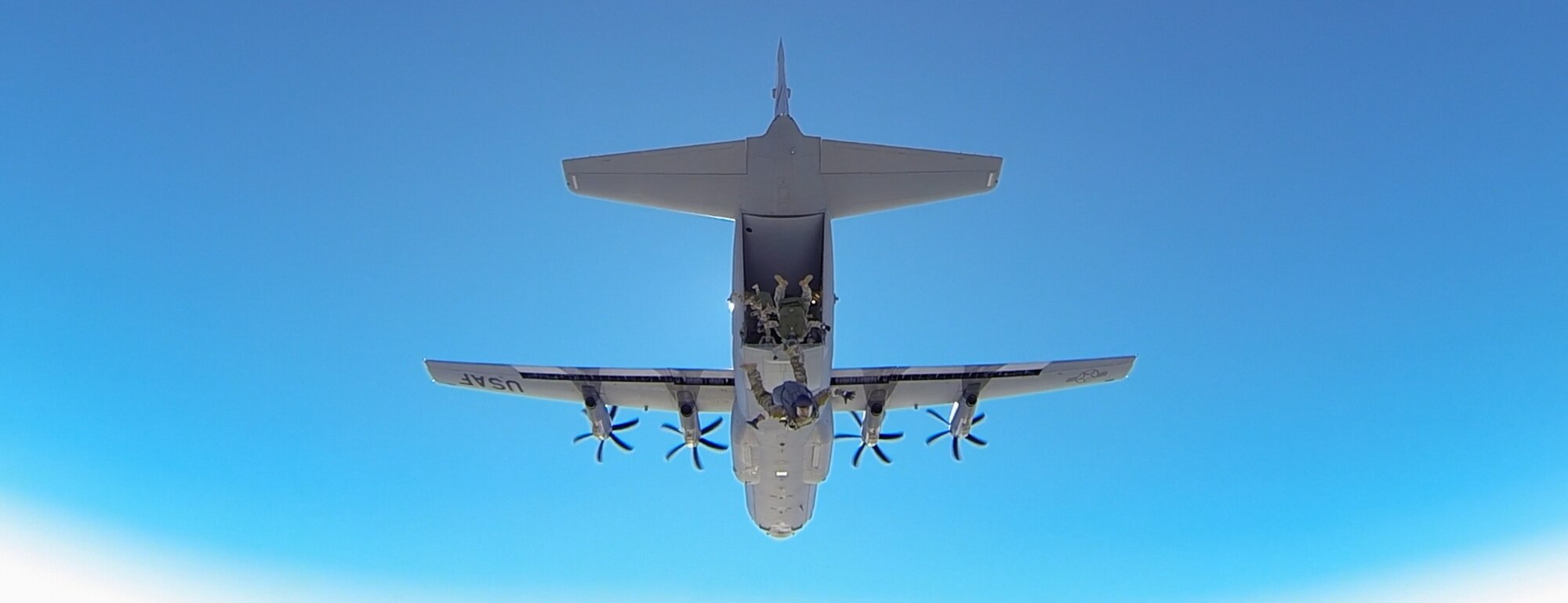 Members of the 334th and 335th Training Squadrons jump from the back of a C-130J Hercules during a parachute jump Jan. 20, 2016, Keesler Air Force Base, Miss. Keesler’s battlefield Airmen instructors periodically perform the routine training exercise to maintain their proficiency. (U.S. Air Force photo by Matt Hames)