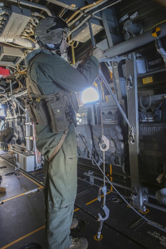Cpl. Joshua Payne, a crew chief with Marine Medium Tiltrotor Squadron (VMM) 161 and a Spring, Texas, native, prepares the litter stanchion, a support mechanism for a stretcher, during casualty-evacuation training aboard Marine Corps Base Camp Pendleton, Calif., Jan. 20. Casualty-evacuation training prepares the Marines to land in a combat zone, pick up injured Marines and transport them to a safe area. (U.S. Marine Corps photo by Lance Cpl. Kimberlyn Adams/Released)