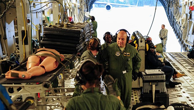Airmen from the 315th Aeromedical Evacuation Squadron at Joint Base Charleston, S.C. and the 48th AES at Pope Air Force Base, load a stretcher during a training mission to Ramstein Air Base, Germany, Jan. 21, 2016.