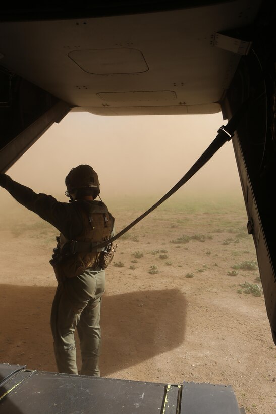 Cpl. Joshua Payne, a crew chief with Marine Medium Tiltrotor Squadron (VMM) 161 and a Spring, Texas, native, waits for a simulated injured Marine during casualty-evacuation training aboard Marine Corps Base Camp Pendleton, Calif., Jan. 20. Casualty-evacuation training prepares the Marines to land in a combat zone, pick up injured Marines and transport them to a safe area. (U.S. Marine Corps photo by Lance Cpl. Kimberlyn Adams/Released)