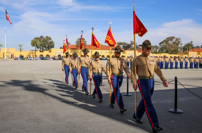 Drill instructors from Charlie Company, 1st Recruit Training Battalion, march in formation after receiving the guidons from the company honormen during the graduation ceremony at Marine Corps Recruit Depot San Diego, Jan. 22. Graduation takes place at the completion of a 13 week transformation including training in drill, marksmanship, basic combat skills and Marine Corps customs and traditions. Annually, more than 17,000 males recruited from the Western Recruiting Region are trained at MCRD San Diego.
