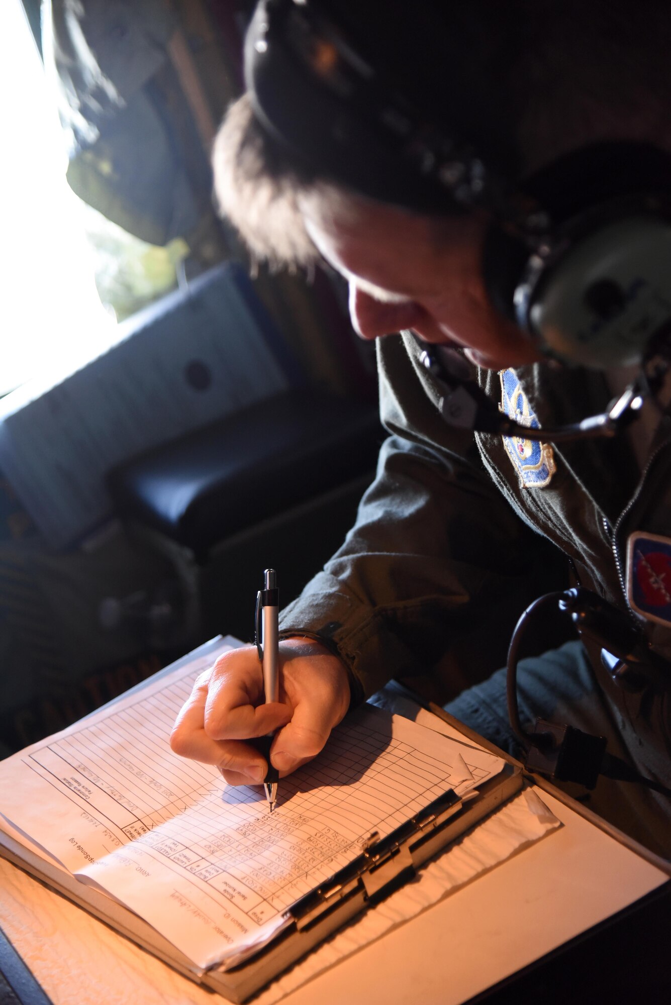 Senior Master Sgt. Jay Latham logs information from a dropsonde released into the blizzard that impacted the East Coast Jan. 22-24, 2016. The dropsondes collect information on the storm's wind speed and direction, temperature, and barometric pressure and the data is sent back to the National Hurricane Center where it is used in forecast models produced by the National Center for Environmental Prediction. (U.S. Air Force photo/Staff Sgt. Nicholas Monteleone)