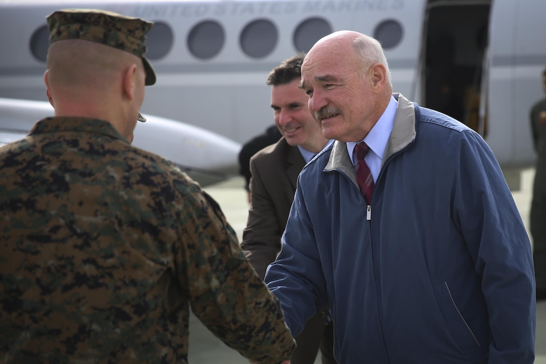 Col. Jay Wylie, assistant chief of staff, G-4 Installations and Logistics, greets the Honorable Dennis V. McGinn, Assistant Secretary of the Navy, at the Strategic Expeditionary Landing Field, Jan. 21, 2016. McGinn later awarded the Combat Center’s Exercise Support Division the 2015 Secretary of the Navy Energy and Water Management Award in the United States Marine Corps Expeditionary category, at Lance Cpl. Torrey L. Gray Field. McGinn also recognized the Combat Center as an installation, for a Gold Level of Achievement under the awards program, which indicates a very good to outstanding energy or water program.  (Official Marine Corps photo by Cpl. Medina Ayala-Lo/Released)