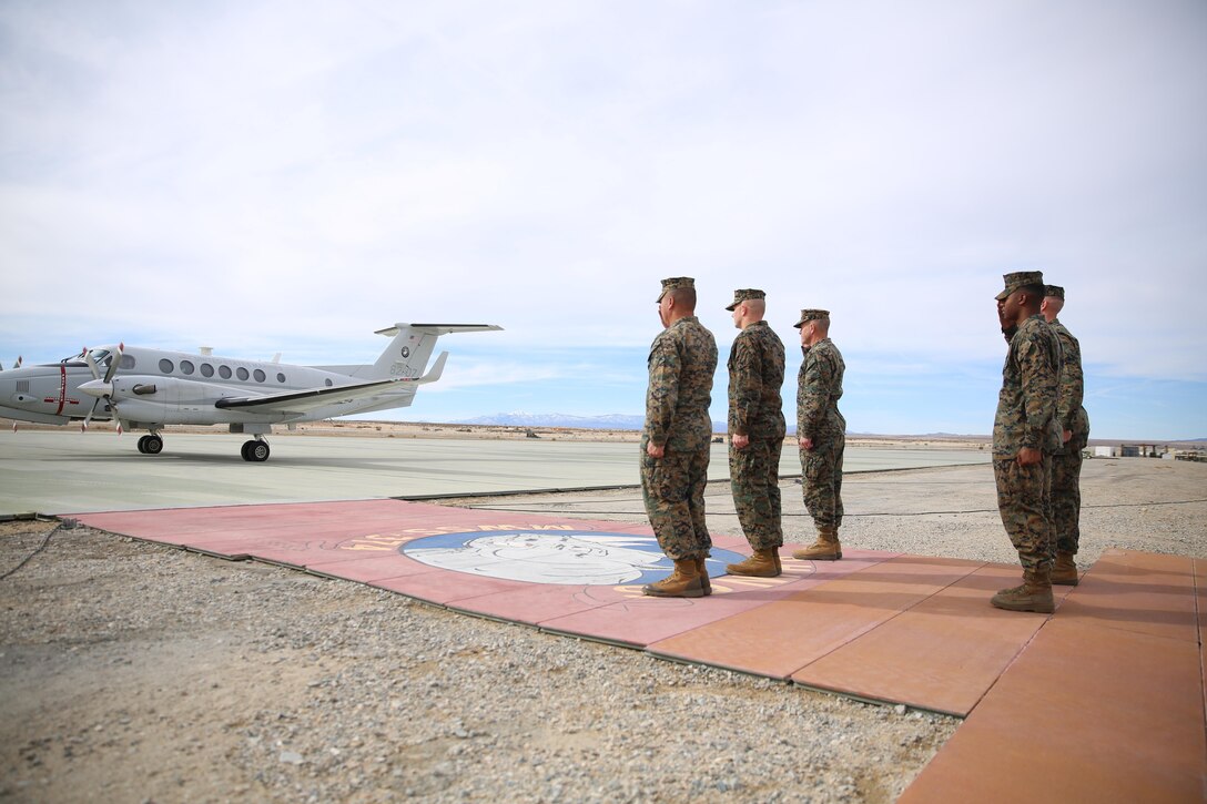 Combat Center leadership salutes the Honorable Dennis V. McGinn, Assistant Secretary of the Navy and Mr. Joseph Bryan, Deputy Assistant Secretary of the Navy, as they land at the Strategic Expeditionary Landing Field, Jan. 21, 2016. McGinn later awarded the Combat Center’s Exercise Support Division the 2015 Secretary of the Navy Energy and Water Management Award in the United States Marine Corps Expeditionary category. McGinn also recognized the Combat Center as an installation, for a Gold Level of Achievement under the awards program, which indicates a very good to outstanding energy or water program. (Official Marine Corps photo by Cpl. Medina Ayala-Lo/Released)