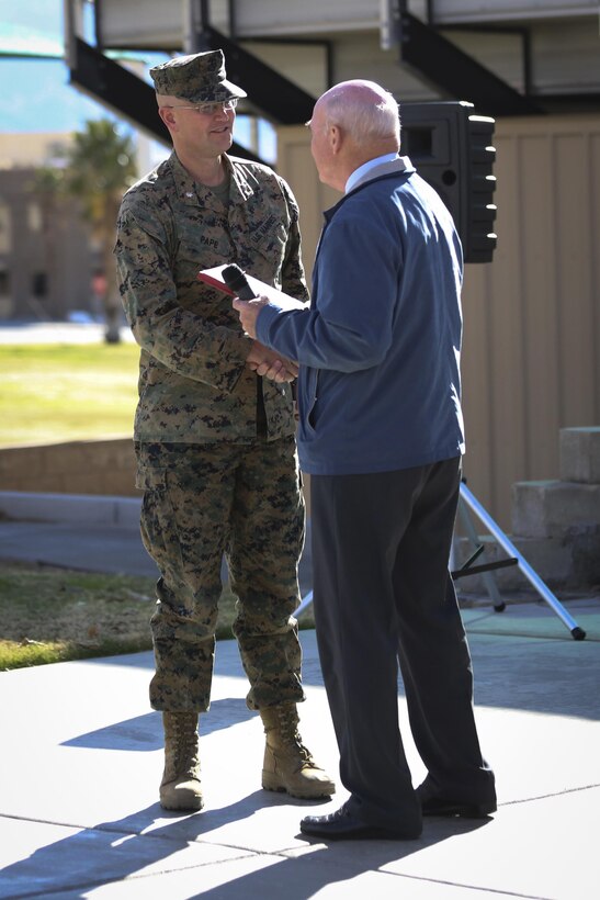 The Honorable Dennis V. McGinn, Assistant Secretary of the Navy, presents the Exercise Support Division’s 2015 Secretary of the Navy Energy and Water Management Award in the United States Marine Corps Expeditionary category to Lt. Col. Randal Pape, officer in charge, ESD, at Lance Cpl. Torrey L. Gray Field, Jan. 21, 2016. (Official Marine Corps photo by Cpl. Medina Ayala-Lo/Released)