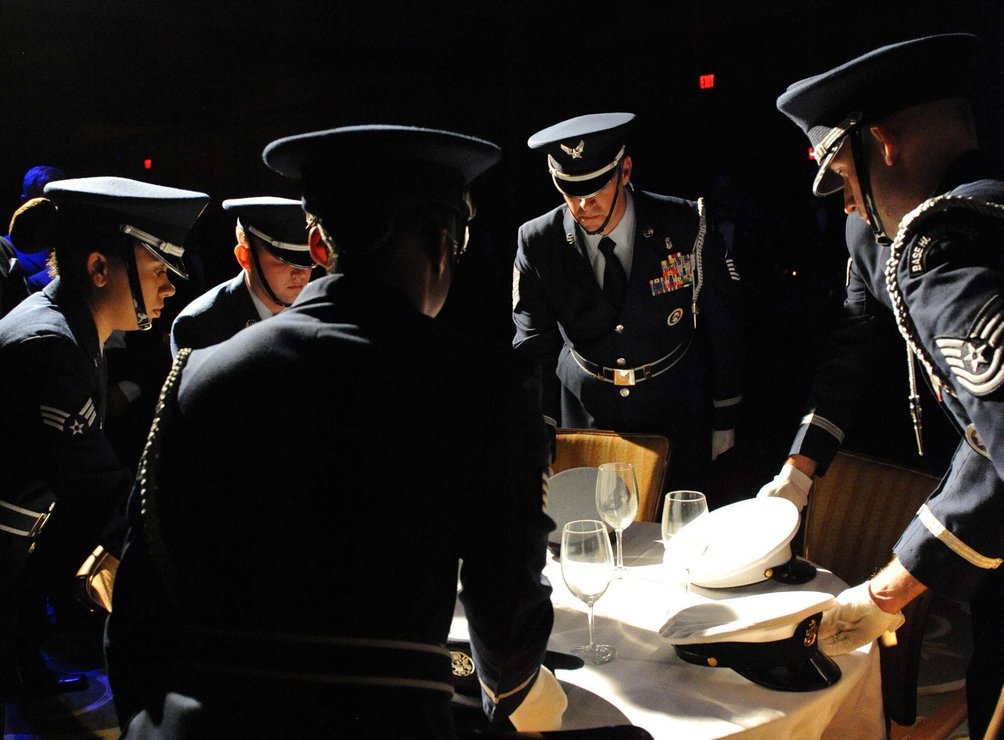 Members of the Keesler Air Force Base Honor Guard perform a POW/MIA table ceremony during the 2015 Keesler Annual Awards Banquet at the Bay Breeze Event Center Jan. 20, 2016, Keesler Air Force Base, Miss. The ceremony recognized outstanding Airmen and civilians in 14 categories. The theme for the event was “ordinary people doing extraordinary things.” (U.S. Air Force photo by Kemberly Groue)