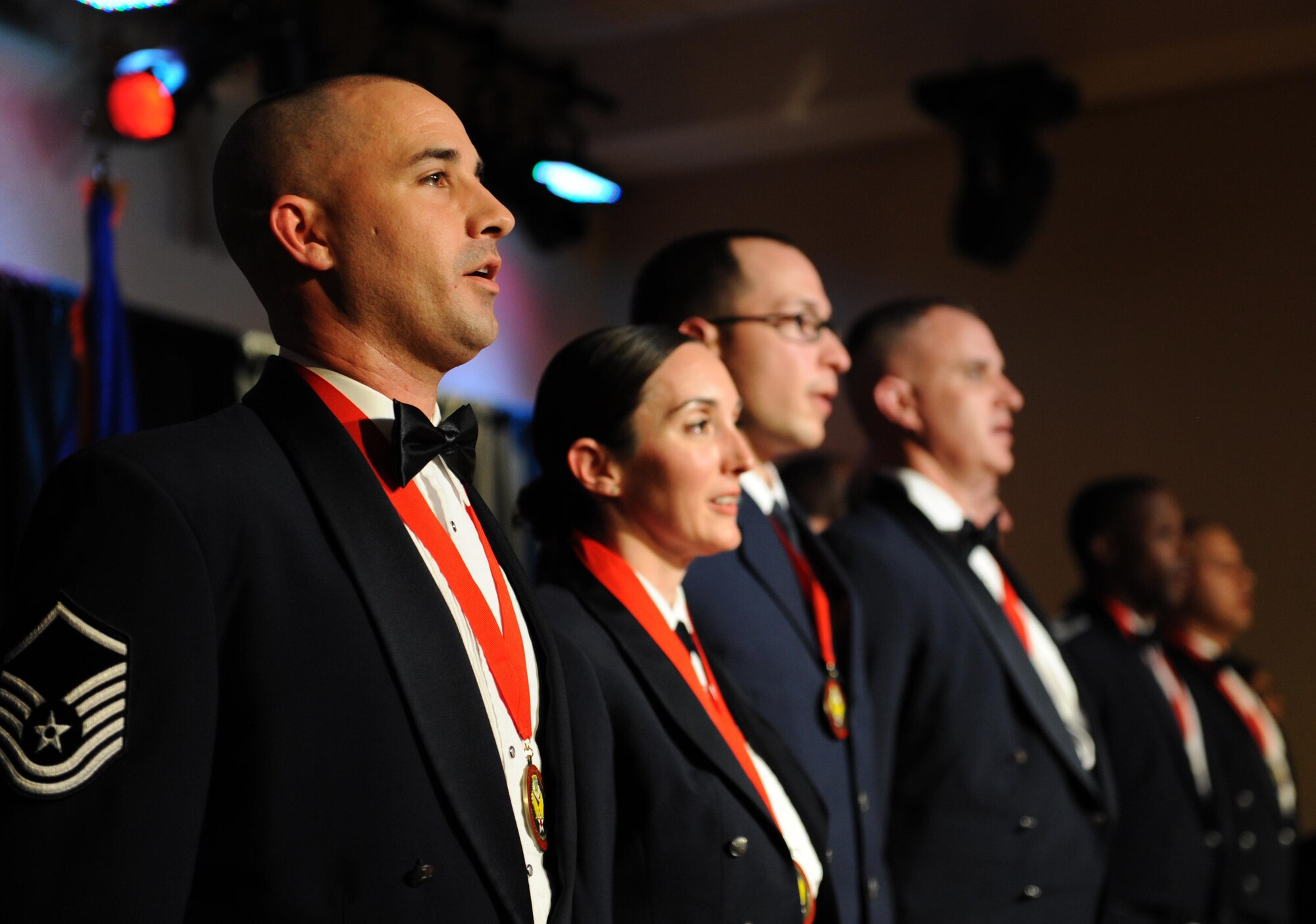 Award winners recite the Airmen’s Creed during the 2015 Keesler Annual Awards Banquet at the Bay Breeze Event Center Jan. 20, 2016, Keesler Air Force Base, Miss. The ceremony recognized outstanding Airmen and civilians in 14 categories for their accomplishments throughout 2015. The theme for the event was “ordinary people doing extraordinary things.” (U.S. Air Force photo by Kemberly Groue)