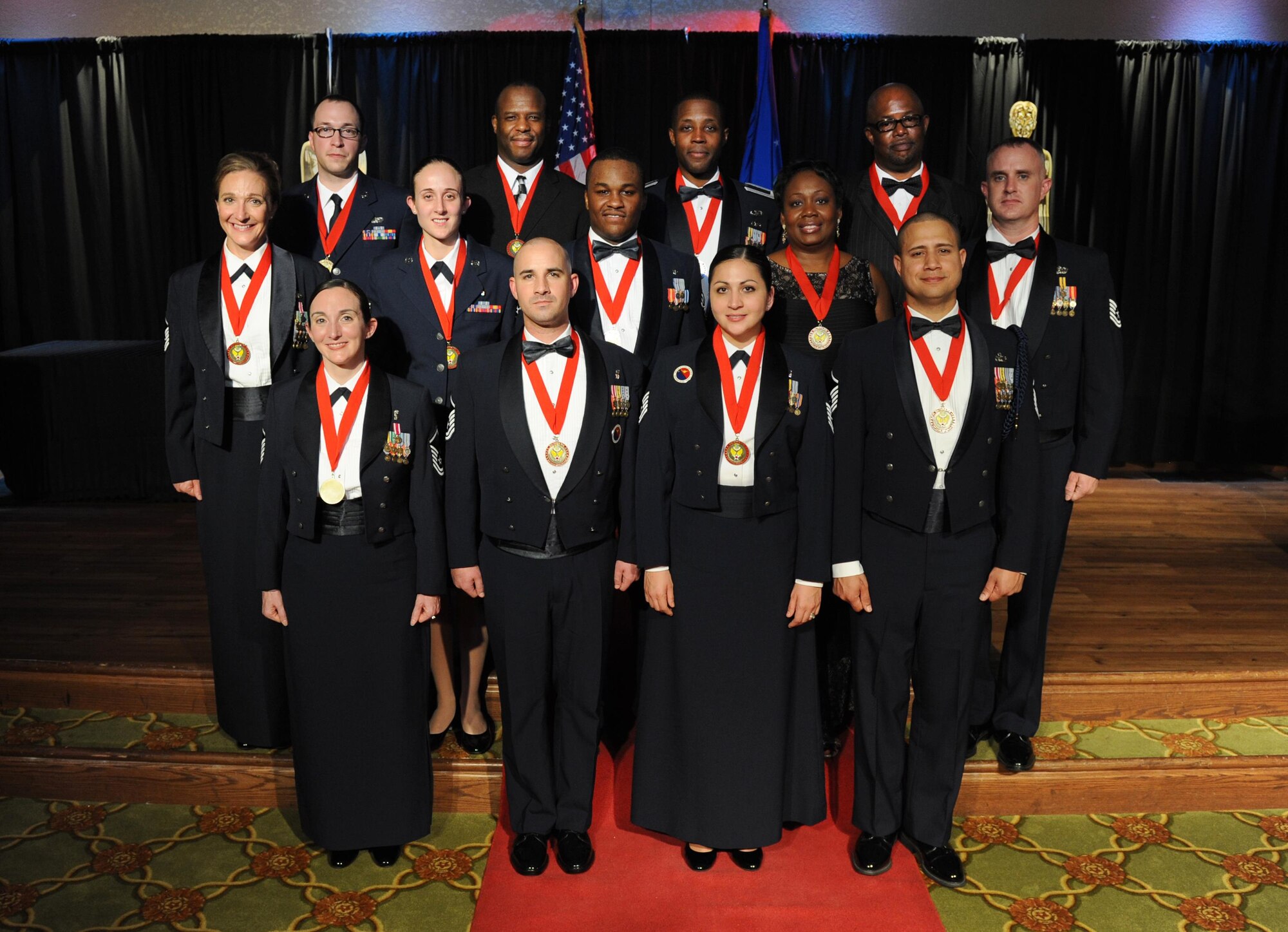 Keesler’s 2015 Annual Award winners take a group photo during the 2015 Keesler Annual Awards Banquet at the Bay Breeze Event Center Jan. 20, 2016, Keesler Air Force Base, Miss. The ceremony recognized outstanding Airmen and civilians in 14 categories for their accomplishments throughout 2015. The theme for the event was “ordinary people doing extraordinary things.” (U.S. Air Force photo by Kemberly Groue)