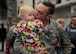 Senior Airman Joseph, 28th Maintenance Group weapons systems controller, kisses his daughter, Aerin, during a homecoming celebration at Ellsworth Air Force Base, S.D., Jan. 24, 2016. Hundreds of family members, loved ones and fellow Airmen gathered on the flightline to greet Airmen home after more than six months of B-1 bomber combat operations in the U.S. Central Command area of responsibility. (U.S. Air Force photo by Airman Sadie Colbert/Released)