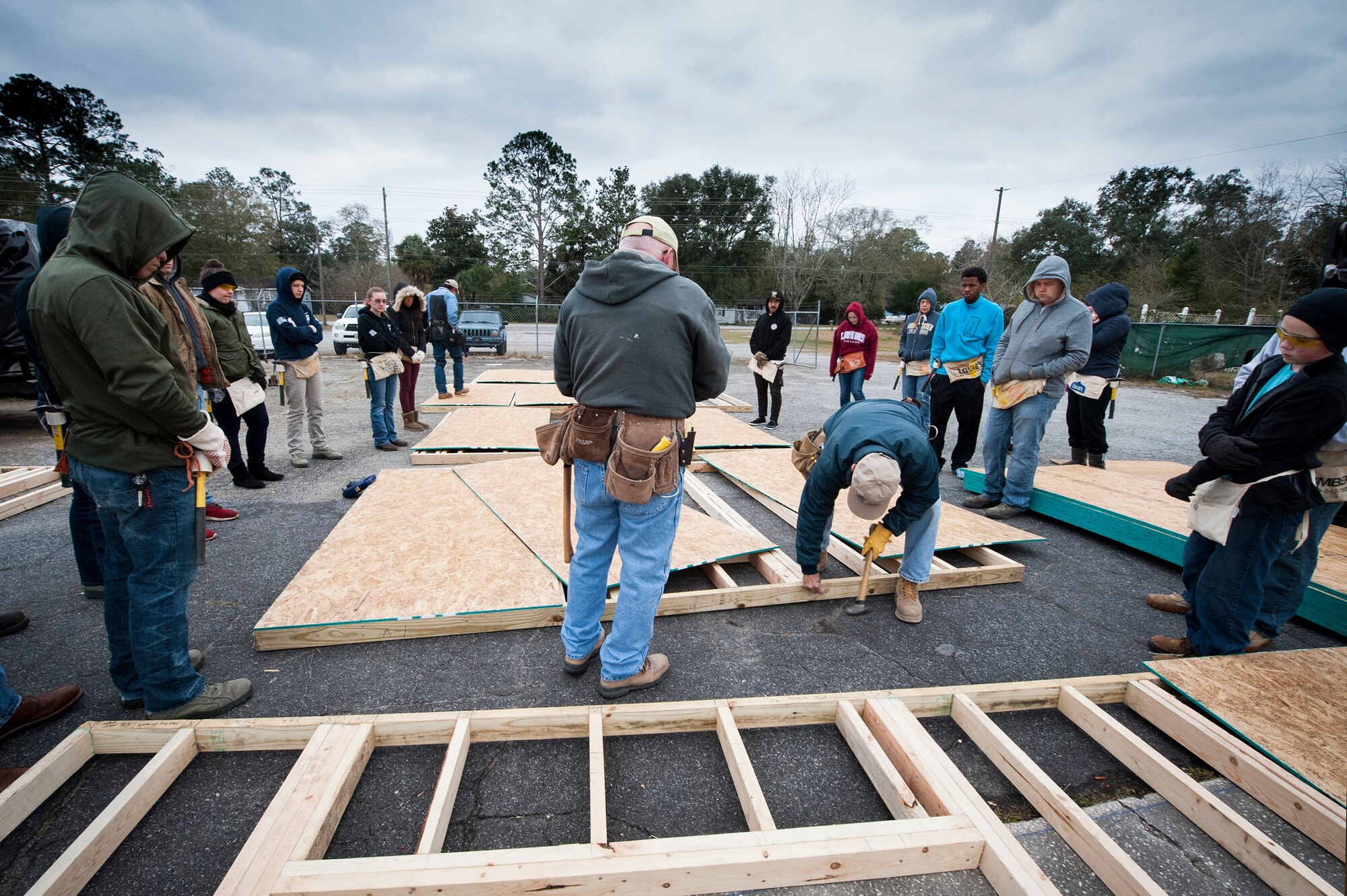 Volunteers from Moody Air Force Base and the local community watch a demonstration during a Habitat for Humanity volunteer event, Jan. 23, 2016, in Valdosta, Ga. Habitat for Humanity is a nonprofit organization dedicated to eliminating substandard housing in the local community. The organization’s mission vision is A world where everyone has a decent place to live. (U.S. Air Force photo by Airman 1st Class Lauren M. Johnson/Released)