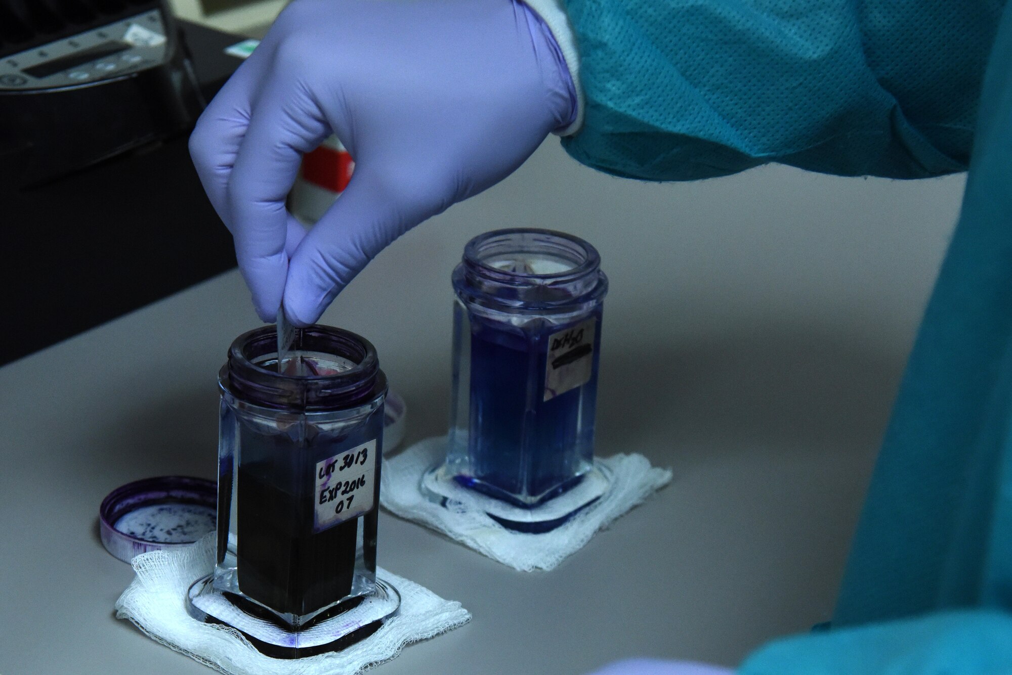 Staff Sgt. Johnmarth Perez, 4th Medical Support Squadron medical laboratory technician, stains a blood sample with dye Jan. 21, 2016, prior to viewing it under a microscope at Seymour Johnson Air Force Base, North Carolina. Perez and eight co-workers conduct more than 71,000 tests annually to provide support for medical providers. (U.S. Air Force photo/Staff Sgt. Chuck Broadway)