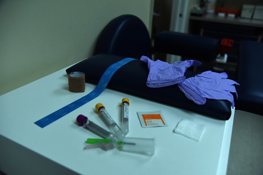 Blood drawing equipment is prepared for use on a patient Jan. 21, 2016, at the 4th Medical Support Squadron's laboratory on Seymour Johnson Air Force Base, North Carolina. Approximately 70 percent of the lab's mission is to collect samples and provide diagnostic and presumptive testing for medical providers treating patients at the 4th Medical Group clinic. (U.S. Air Force photo/Staff Sgt. Chuck Broadway)