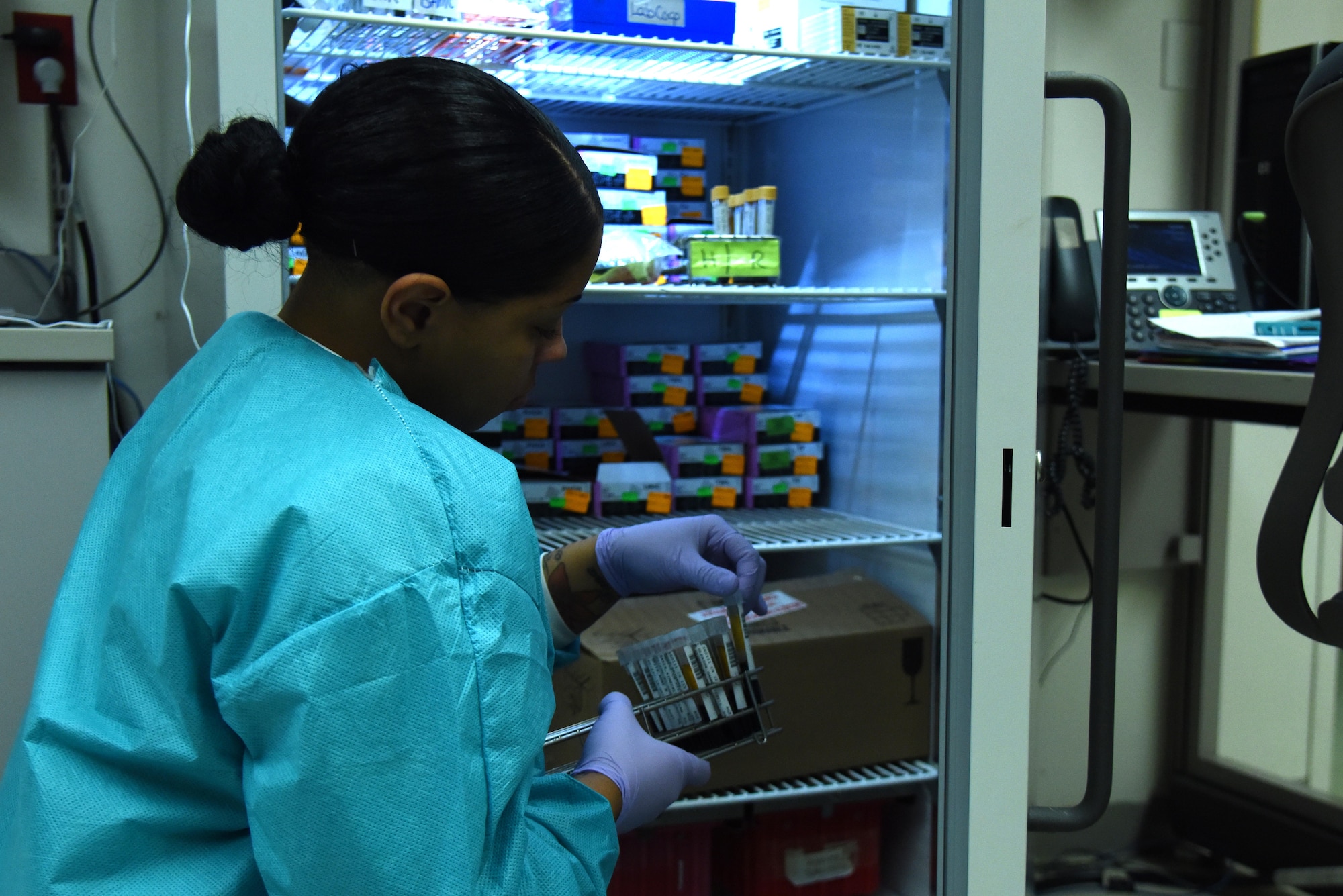 Senior Airman Kiersten Zardee, 4th Medical Support Squadron medical laboratory technician, searches vials of blood samples Jan. 21, 2016, at Seymour Johnson Air Force Base, North Carolina. Laboratory technicians collect and analyze specimens for all members of Team Seymour. At times, samples are shipped to any number of other facilities across the country for specialized testing in order to provide the best care possible for patients and medical providers at the 4th Medical Group. (U.S. Air Force photo/Staff Sgt. Chuck Broadway)