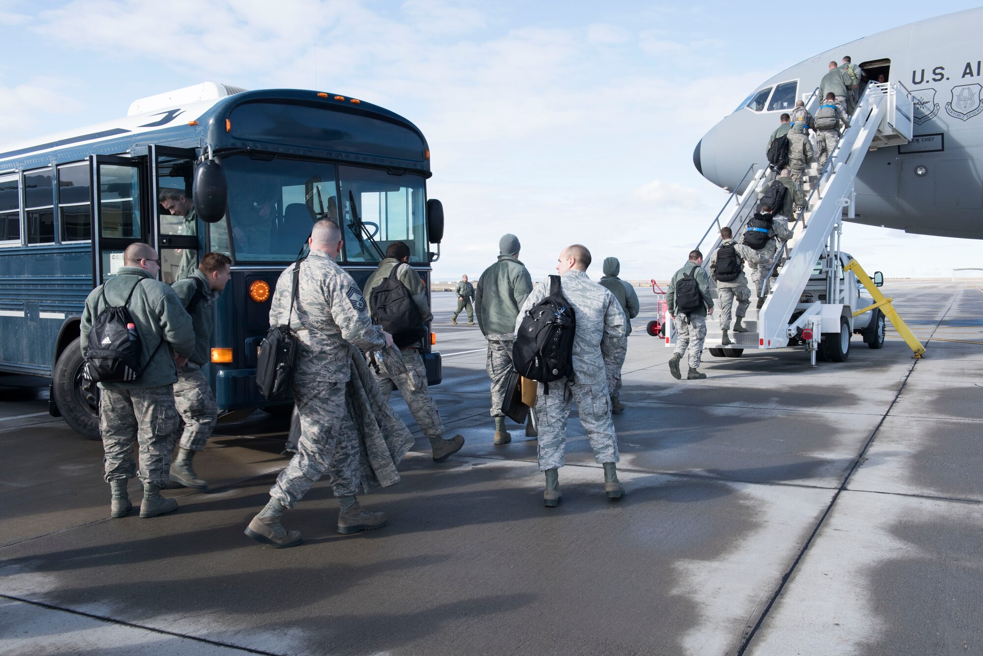 Airmen from the 389th Fighter Squadron board a KC-10 Extender from Travis Air Force Base, California, for Combat Archer and Combat Hammer, Jan. 24, 2016 at Mountain Home Air Force Base, Idaho. The exercise provides support for pre-deployment, employment and redeployment for all those participating. (U.S. Air Force photo by Senior Airman Lauren-Taylor Levin/RELEASED)