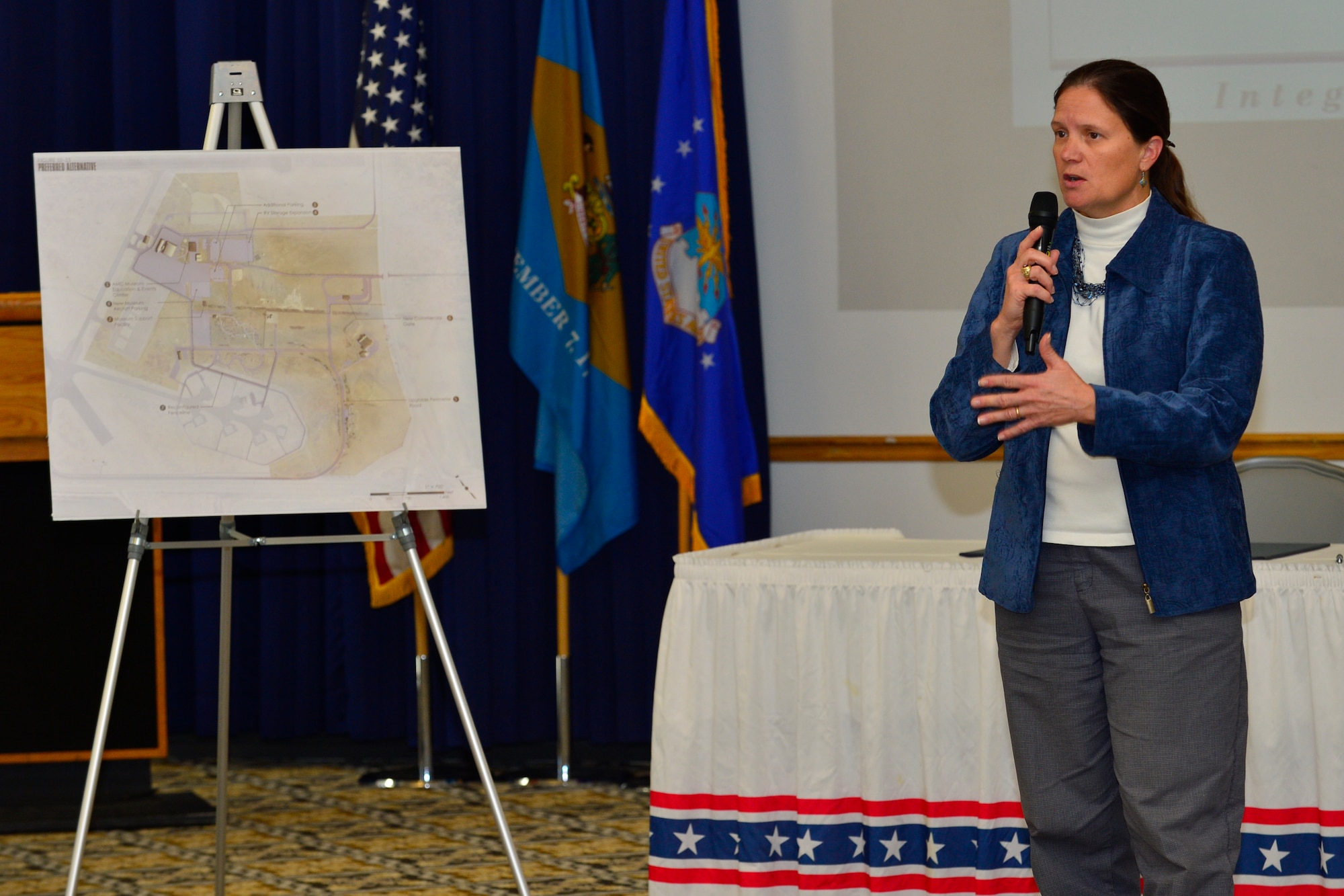 Gina Lavender, 436th Civil Engineer Squadron deputy director, speaks about the Air Mobility Command Museum Expanded Use initiative during the First State Community Partnership Agreement signing event Jan. 20, 2016, at the Landings on Dover Air Force Base, Del. The initiative explores opportunities to utilize the AMC Museum as a venue for community events. (U.S. Air Force photo/Senior Airman William Johnson)