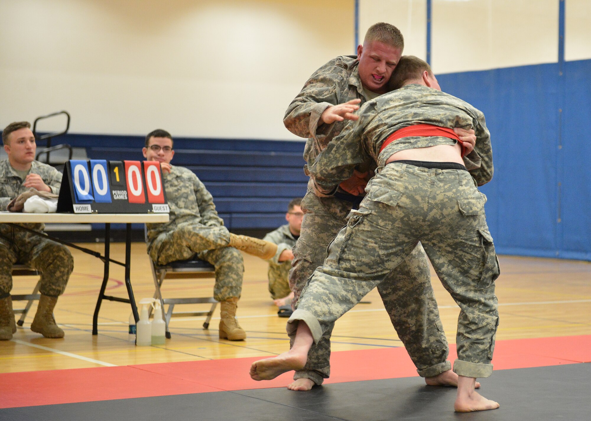 Two U.S. Army 743rd Military Intelligence Battalion Squadron soldiers compete for commander’s cup points during a combatives tournament at the Buckley Fitness Center Jan. 22, 2015, on Buckley Air Force Base, Colo. The army battalion hosts the tournament every year to hone hand-to-hand combat training techniques while engaging in friendly competition. (U.S. Air Force photo by Staff Sgt. Darren Scott/Released)