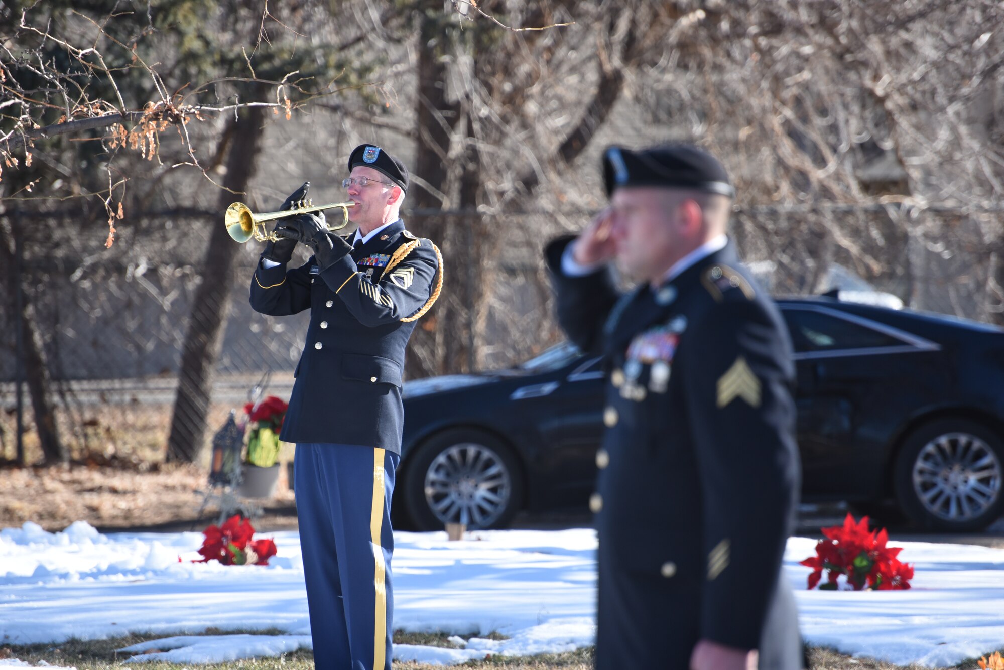 U.S. Army National Guard Staff Sgt. Lance Christiensen with 101st Army Band renders military honors for Medal of Honor recipient U.S. Army Pvt. George “Joe” Sakato at Fairmount Cemetery in Denver, Jan. 16, 2016. Sakato distinguished himself by extraordinary heroism in action Oct. 29, 1944, on Hill 617 in the vicinity of Biffontaine, France. (U.S. Army National Guard photo by Staff Sgt. Manda Walters/Released)