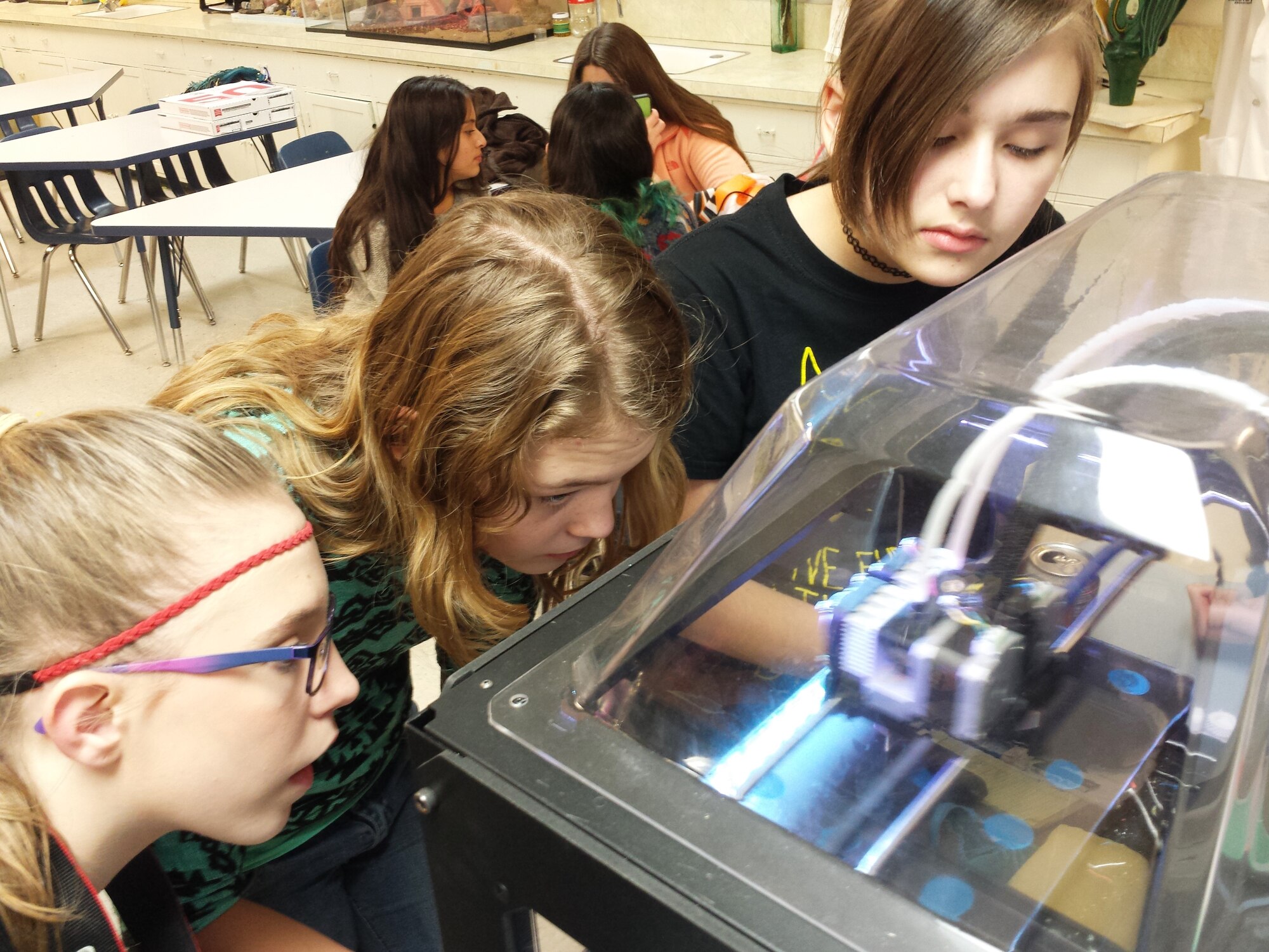 Students Colleen Wainright, Brooke Sanders and Kinsey York watch as the 3D printer works to create an object layer by layer. The printer, initially obtained through an Innovation Grant for a project at AEDC, was recently donated to the AEDC STEM Program. (U.S. Air Force photo/Jere Matty)