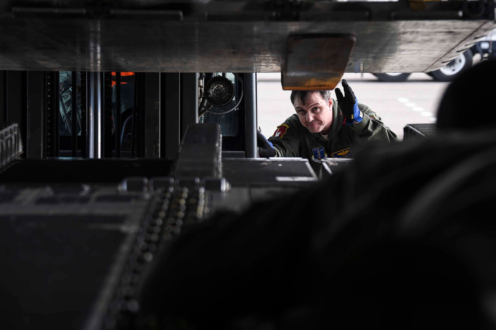 U.S. Air Force Master Sgt. Daryl Martini, New York Air National Guard’s 105th Airlift Wing load master, helps load a C-17 Globemaster III at the Fresno Air National Guard Base, Jan. 21, 2016, in support of the 144th Fighter Wing’s participation in Red Flag 16-01. Red Flag is a realistic combat training exercise, which is hosted by Nellis Air Force Base, Nevada and the U.S. Air Force Warfare Center. The 105th AW airlifted 12 pallets and 29 personnel assigned to the 144th FW. (U.S. Air National Guard Senior Airman Klynne Pearl Serrano)