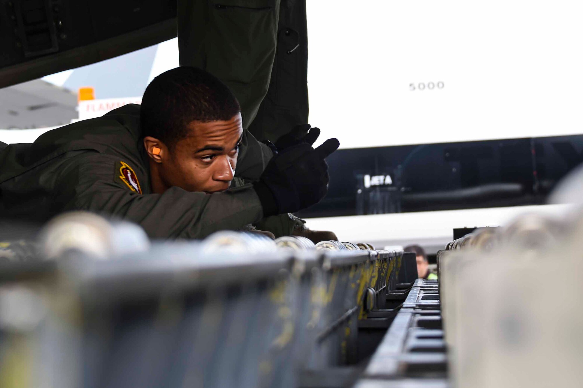 U.S. Air Force Airman 1st Class Seneca Williams, a New York Air National Guard 105th Airlift Wing load master, helps position a pallet to load onto a C-17 Globemaster III at the Fresno Air National Guard Base, Jan. 21, 2016, in support of the 144th Fighter Wing’s participation in Red Flag 16-01. Red Flag is a realistic combat training exercise, which is hosted by Nellis Air Force Base, Nevada and the U.S. Air Force Warfare Center. The 105th AW airlifted 12 pallets and 29 personnel assigned to the 144th FW. (U.S. Air National Guard Senior Airman Klynne Pearl Serrano)
