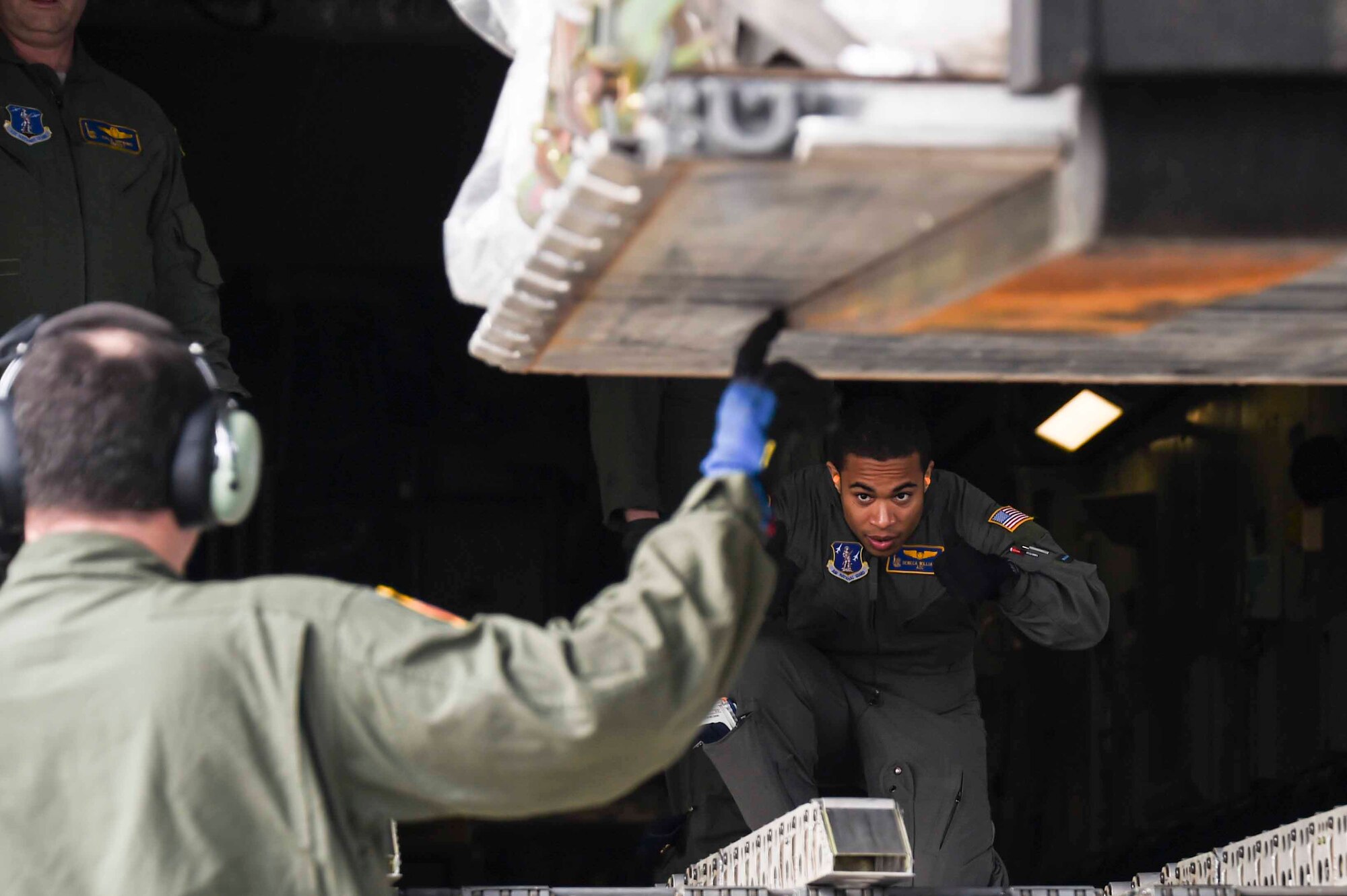 U.S. Air Force Airman 1st Class Seneca Williams, a New York Air National Guard 105th Airlift Wing load master, helps position a pallet to load onto a C-17 Globemaster III at the Fresno Air National Guard Base, Jan. 21, 2016, in support of the 144th Fighter Wing’s participation in Red Flag 16-01. Red Flag is a realistic combat training exercise, which is hosted by Nellis Air Force Base, Nevada and the U.S. Air Force Warfare Center. The 105th AW airlifted 12 pallets and 29 personnel assigned to the 144th FW. (U.S. Air National Guard Senior Airman Klynne Pearl Serrano)