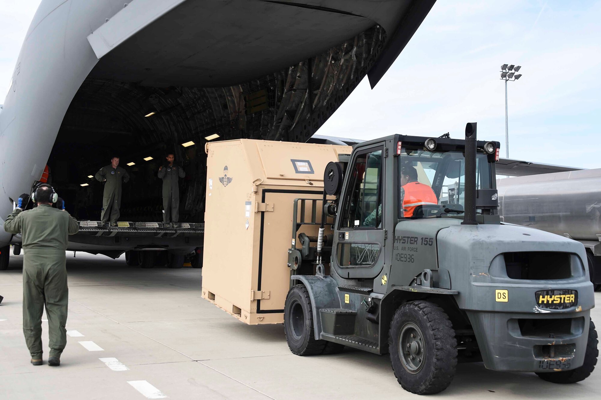 Airmen assigned to the New York Air National Guard’s 105th Airlift Wing and Fresno ANG’s 144th Fighter Wing, load a C-17 Globemaster III at the Fresno ANG Base, Jan. 21, 2016, in support of the 144th FW's participation in Red Flag 16-01. Red Flag is a realistic combat training exercise, which is hosted by Nellis Air Force Base, Nevada and the U.S. Air Force Warfare Center. The 105th AW airlifted 12 pallets and 29 personnel assigned to the 144th FW. (U.S. Air National Guard Senior Airman Klynne Pearl Serrano)