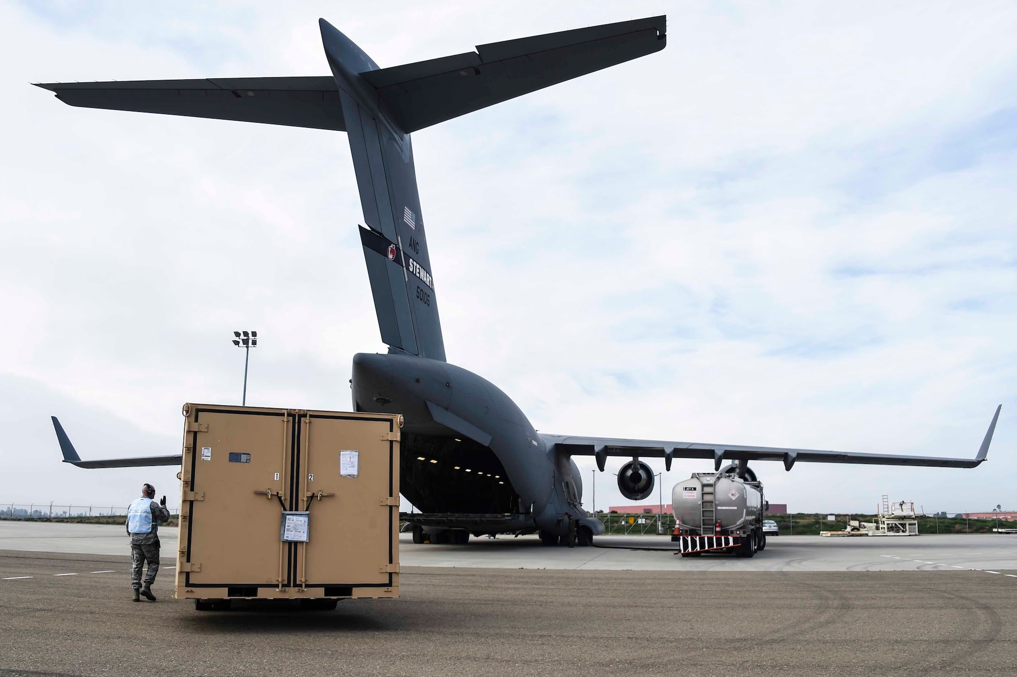 Airmen assigned to the New York Air National Guard’s 105th Airlift Wing and Fresno ANG’s 144th Fighter Wing, prepare to load a C-17 Globemaster III at the Fresno ANG Base, Jan. 21, 2016, in support of the 144th FW's participation in Red Flag 16-01. Red Flag is a realistic combat training exercise, which is hosted by Nellis Air Force Base, Nevada and the U.S. Air Force Warfare Center. The 105th AW airlifted 12 pallets and 29 personnel assigned to the 144th FW. (U.S. Air National Guard Senior Airman Klynne Pearl Serrano)