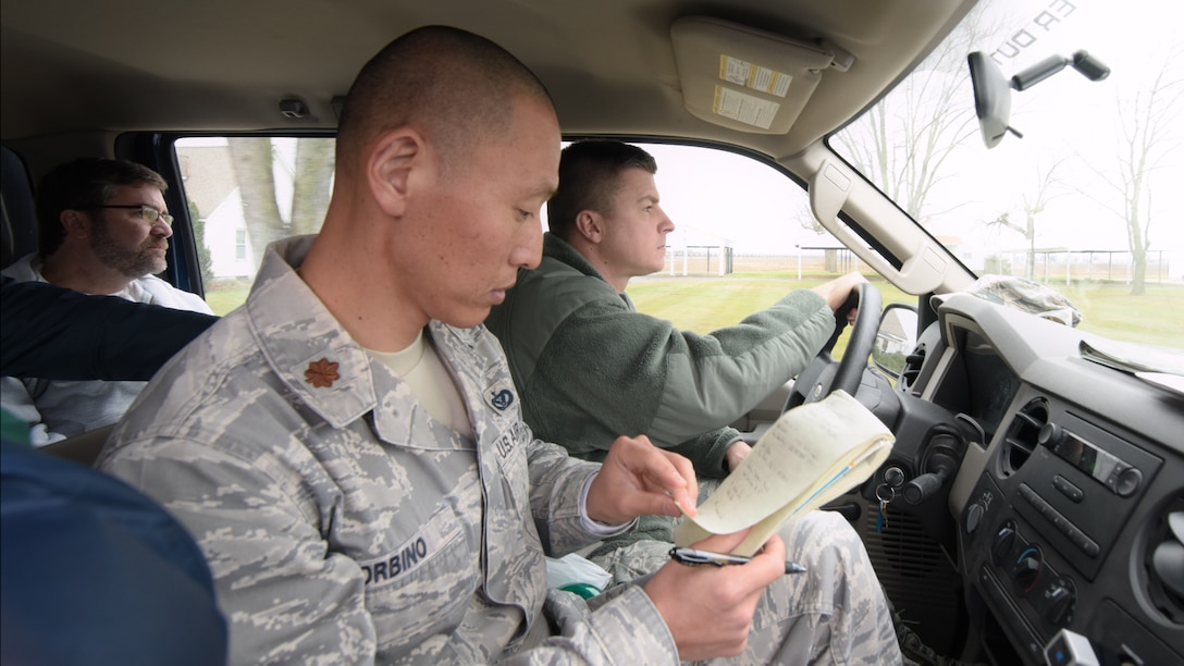 Missouri Air National Guard liaison officers Tech. Sgt. Michael Terranova of the 131st Bomb Wing and Maj. Greg Orbino of the 231st Civil Engineer Flight assess the damage along with Army Corps Engineer Clint Wilson in West Alton, MO on Jan 8th, 2016. (Courtesy photo) 